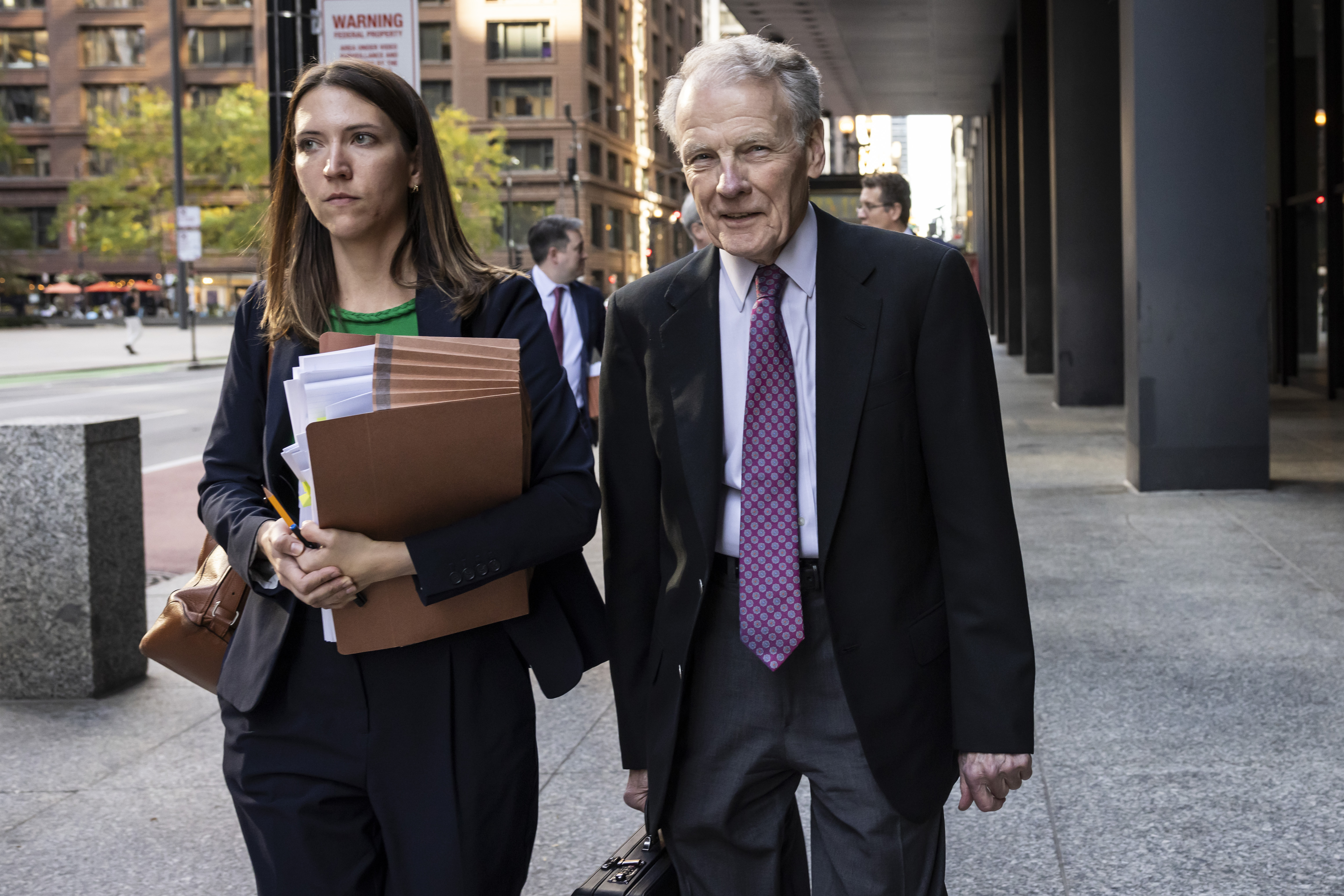 Illinois' former House Speaker Michael Madigan, charged in a multimillion-dollar racketeering and bribery scheme that included the state’s largest utility, ComEd, walks out of the Dirksen Federal Courthouse, Wednesday, Oct. 9, 2024 in Chicago. (Ashlee Rezin/Chicago Sun-Times via AP)