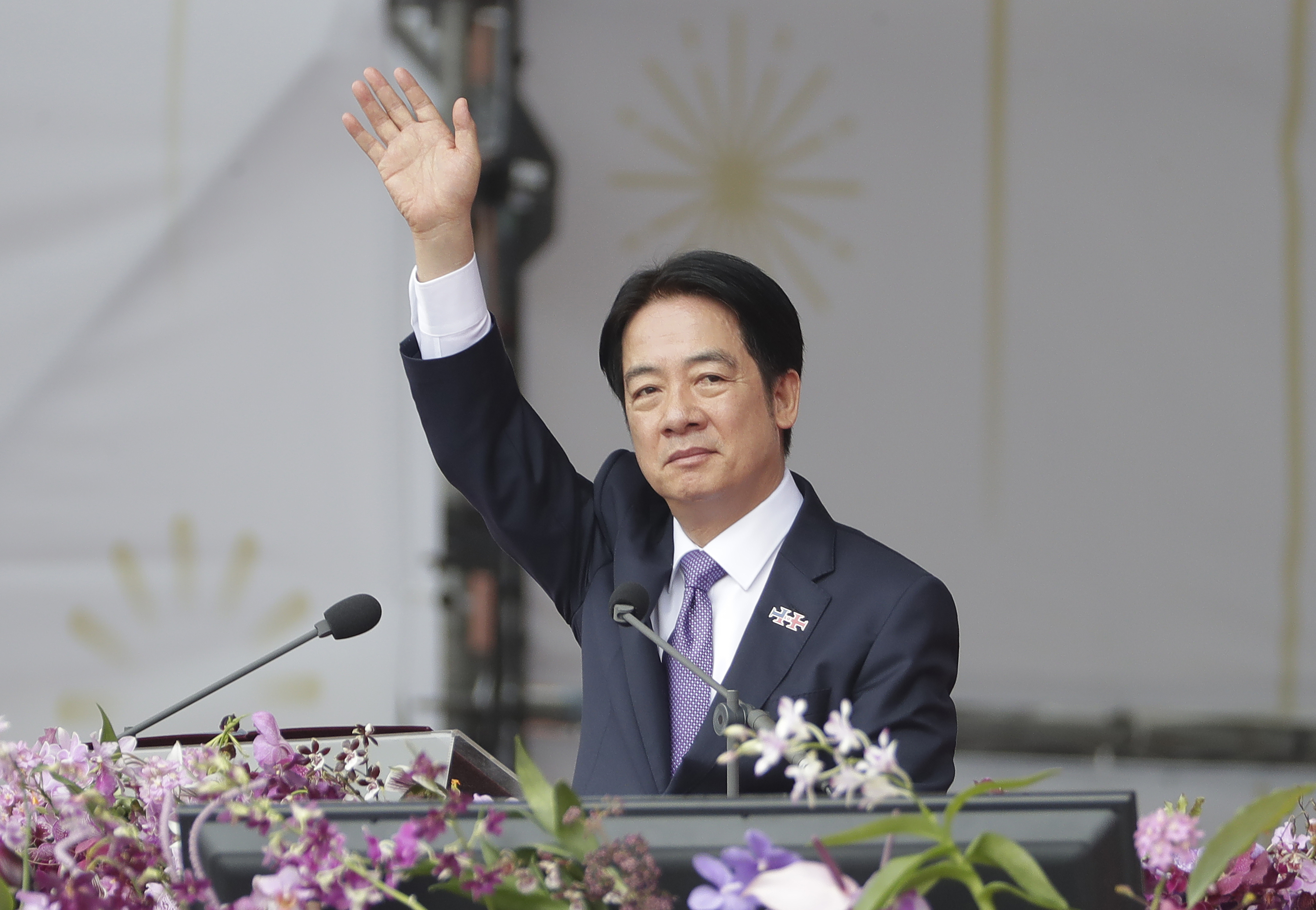 Taiwanese President Lai Ching-te waves during National Day celebrations in front of the Presidential Building in Taipei, Taiwan, Thursday, Oct. 10, 2024. (AP Photo/Chiang Ying-ying)