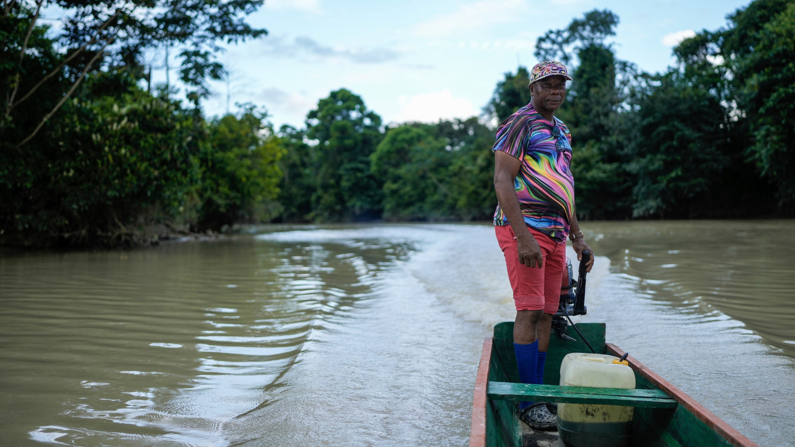 Bernardino Mosquera, a river guardian, maneuvers his boat on the Quito River, near Paimado, Colombia, Monday, Sept. 23, 2024. (AP Photo/Ivan Valencia)