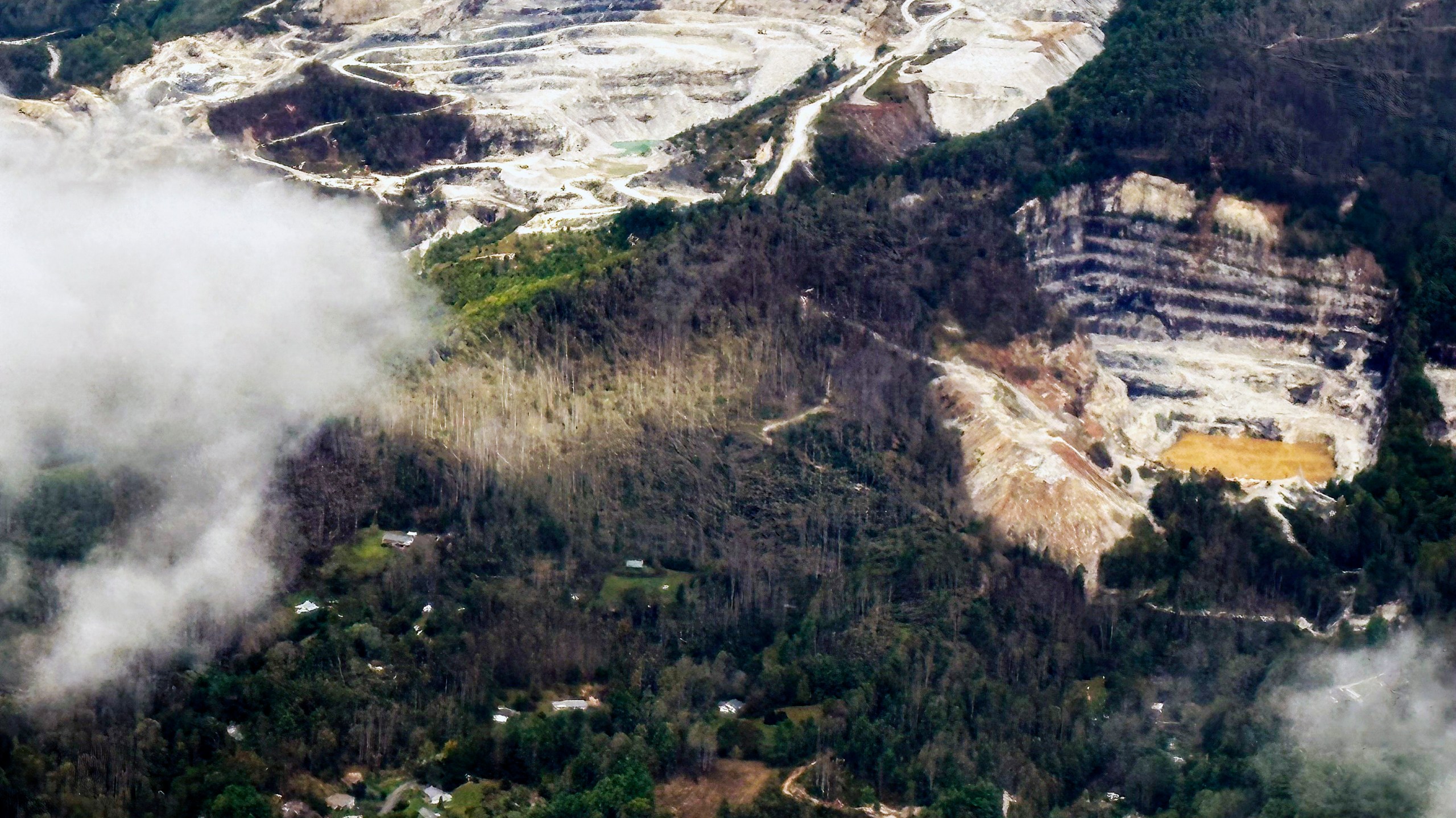 An aerial view of quartz mines in Spruce Pine, N.C., as taken from a plane on Monday, Sept. 30, 2024. (AP Photo/Gary D. Robertson)