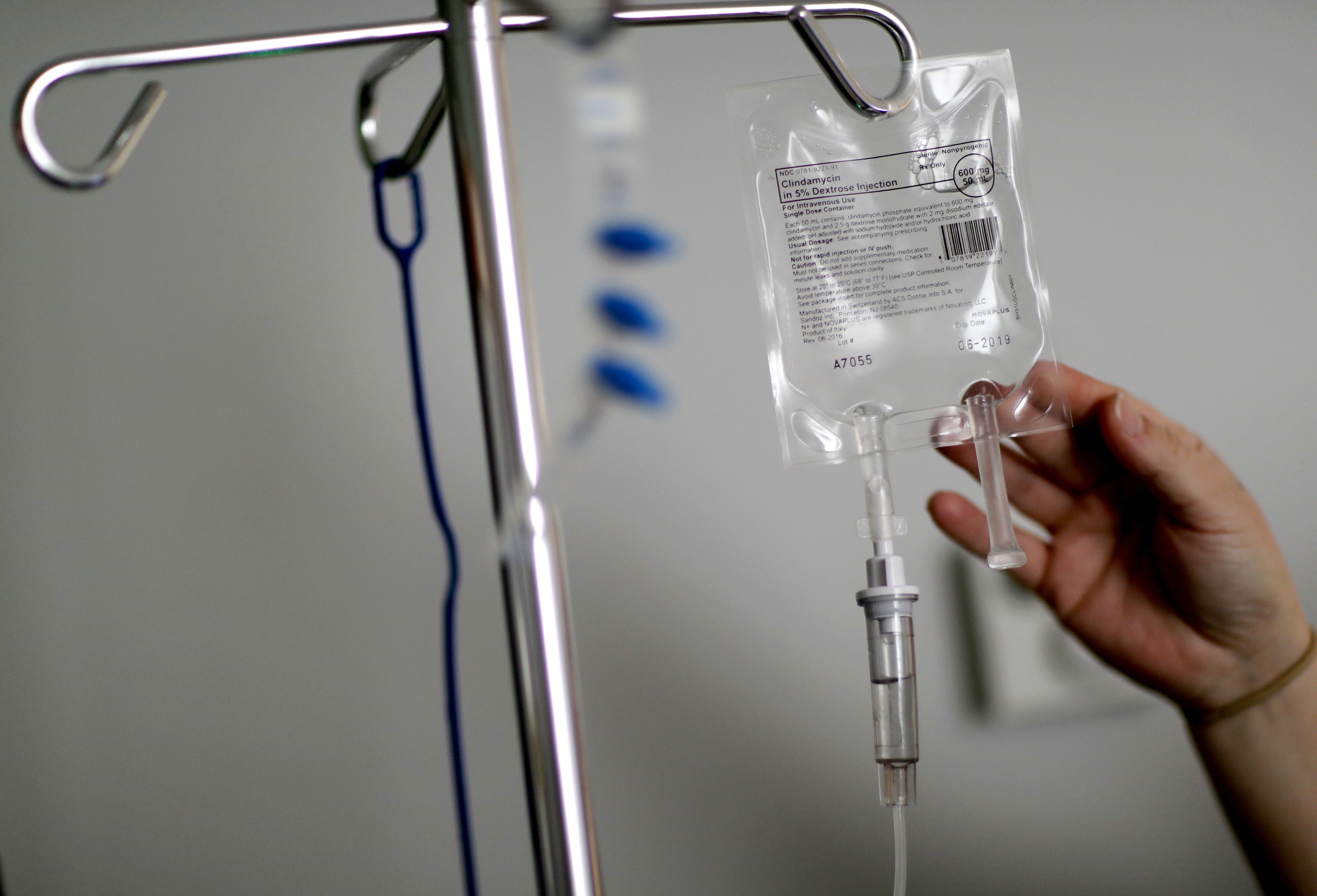 FILE - A nurse hooks up an IV to a flu patient at Upson Regional Medical Center in Thomaston, Ga., Feb. 9, 2018. (AP Photo/David Goldman, File)