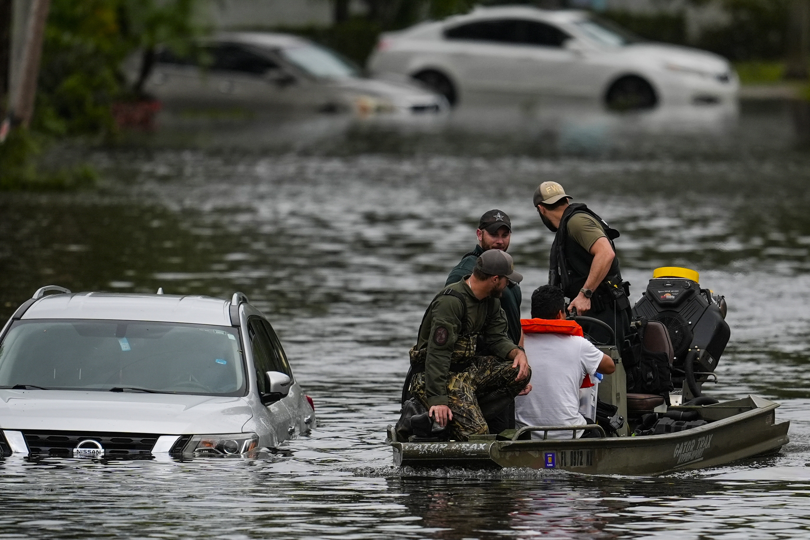 People are rescued from an apartment complex in the aftermath of Hurricane Milton, Thursday, Oct. 10, 2024, in Clearwater, Fla. (AP Photo/Mike Stewart)