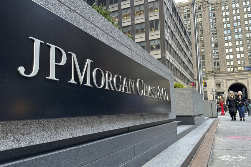 FILE - Pedestrians approach JP Morgan Chase headquarters, Dec. 29, 2023, in New York. (AP Photo/Peter Morgan, File)