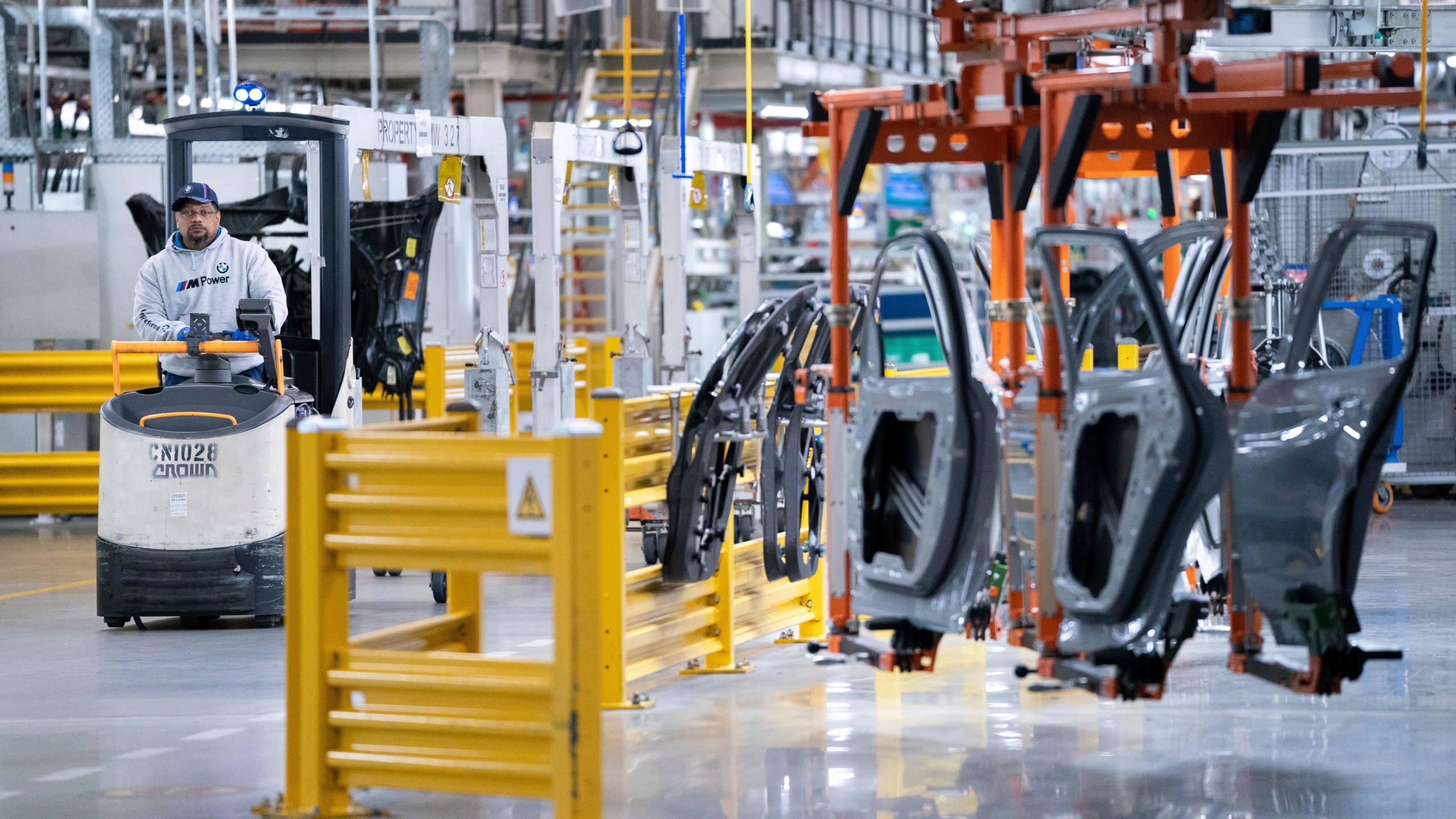 FILE - A worker operates a machine at the BMW Spartanburg plant in Greer, S.C., on Oct. 19, 2022. (AP Photo/Sean Rayford, File)