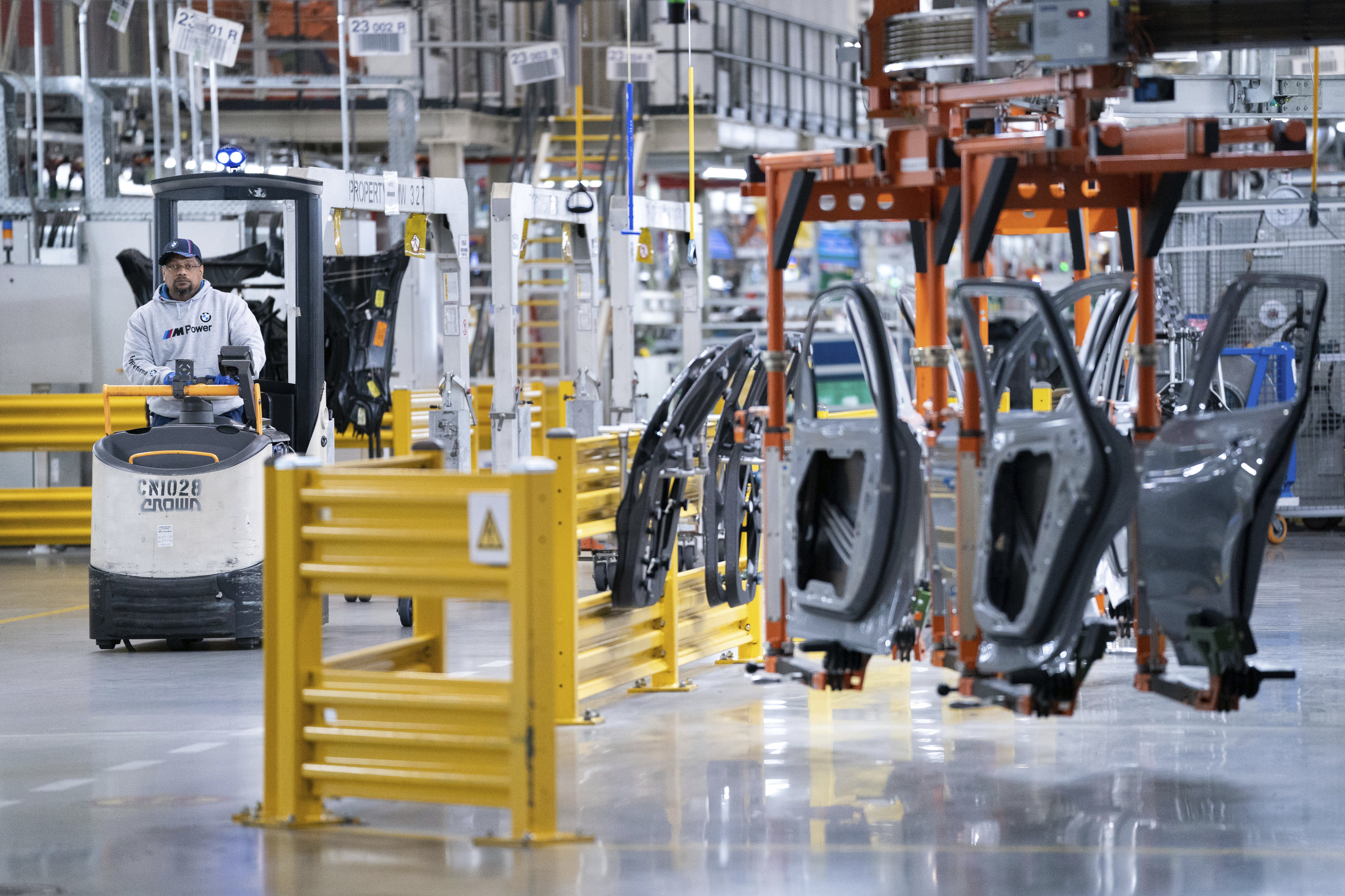 FILE - A worker operates a machine at the BMW Spartanburg plant in Greer, S.C., on Oct. 19, 2022. (AP Photo/Sean Rayford, File)