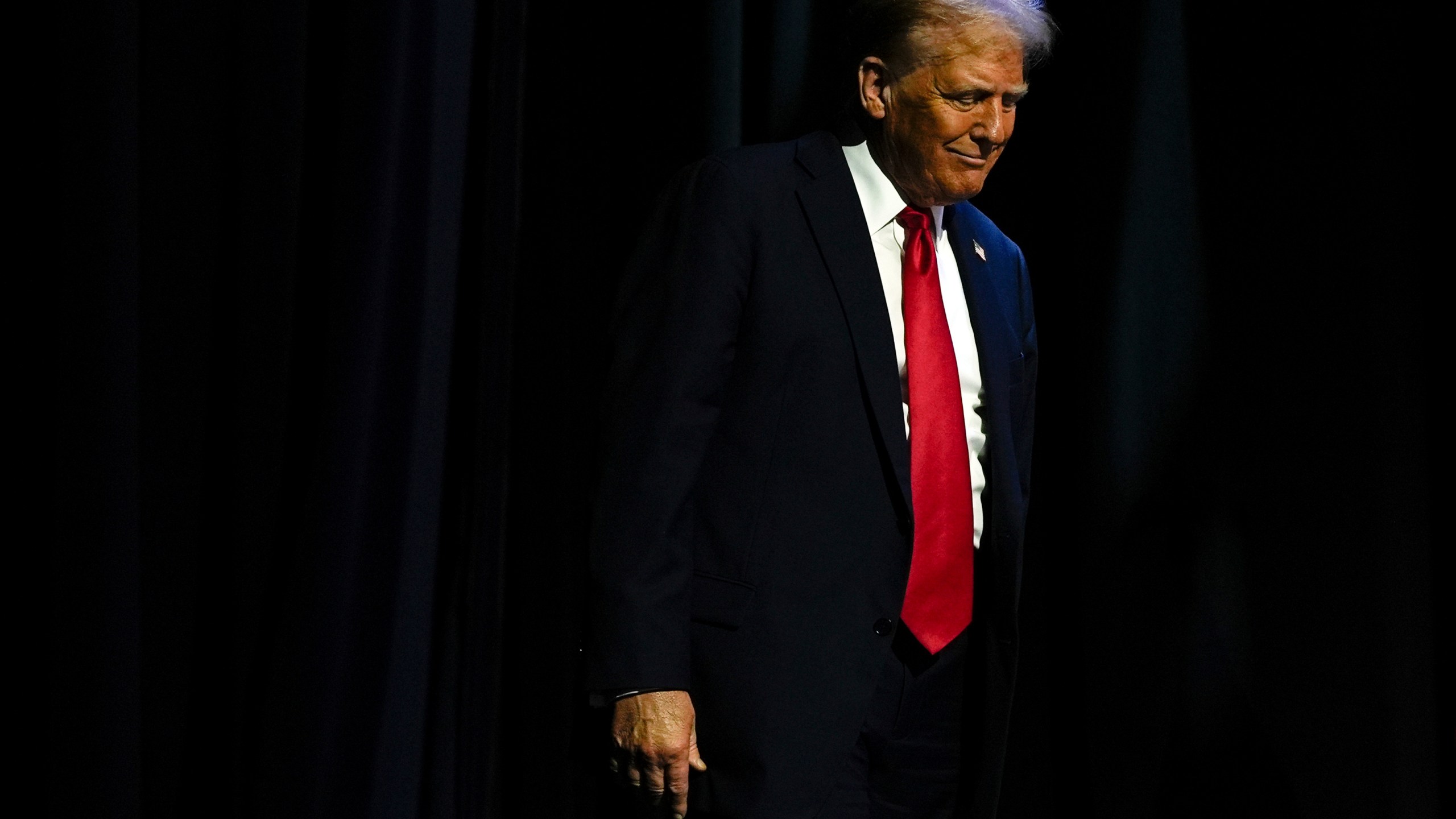 Republican presidential nominee former President Donald Trump arrives to speak at a meeting of the Detroit Economic Club, Thursday, Oct. 10, 2024, in Detroit. (AP Photo/Julia Demaree Nikhinson)