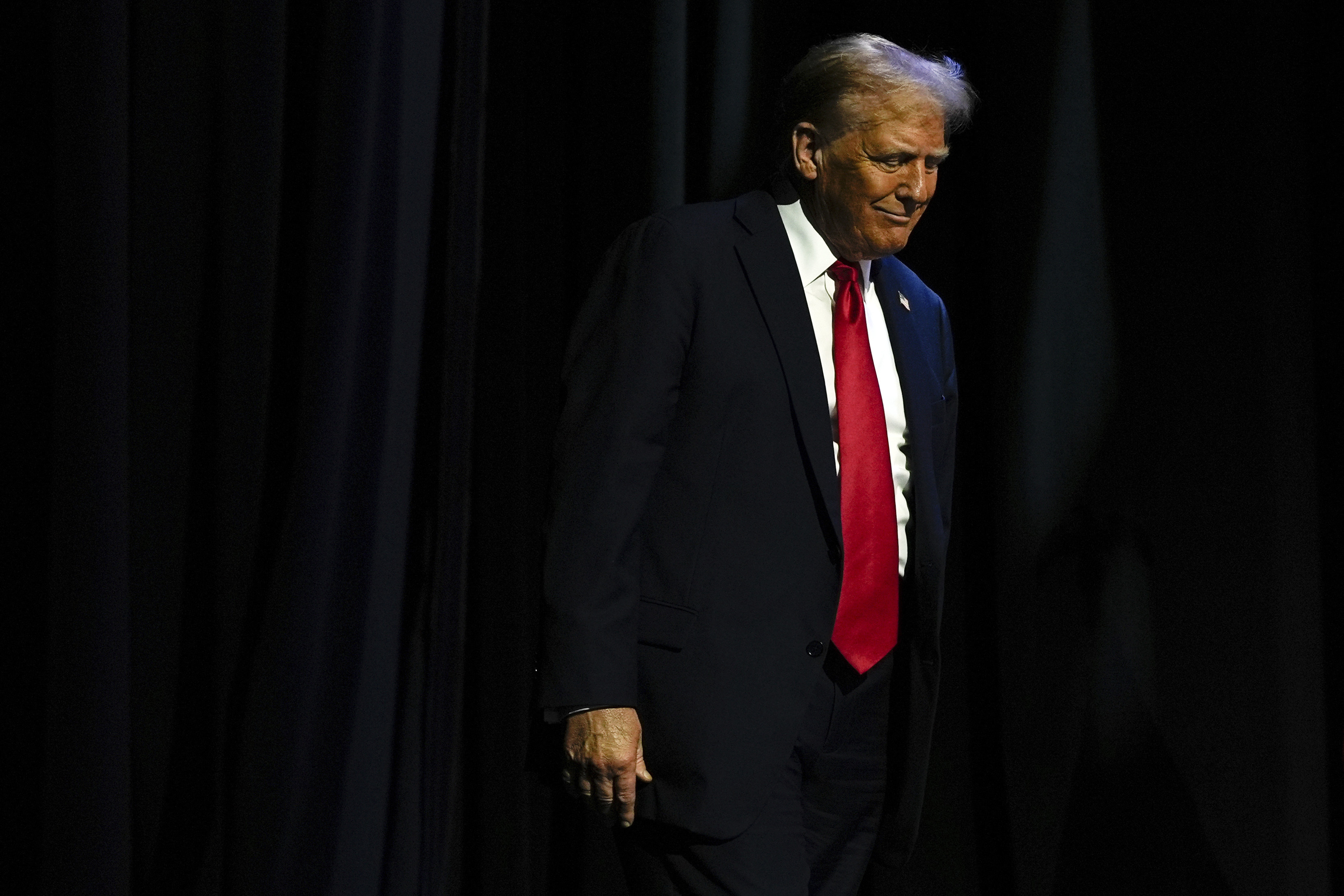 Republican presidential nominee former President Donald Trump arrives to speak at a meeting of the Detroit Economic Club, Thursday, Oct. 10, 2024, in Detroit. (AP Photo/Julia Demaree Nikhinson)