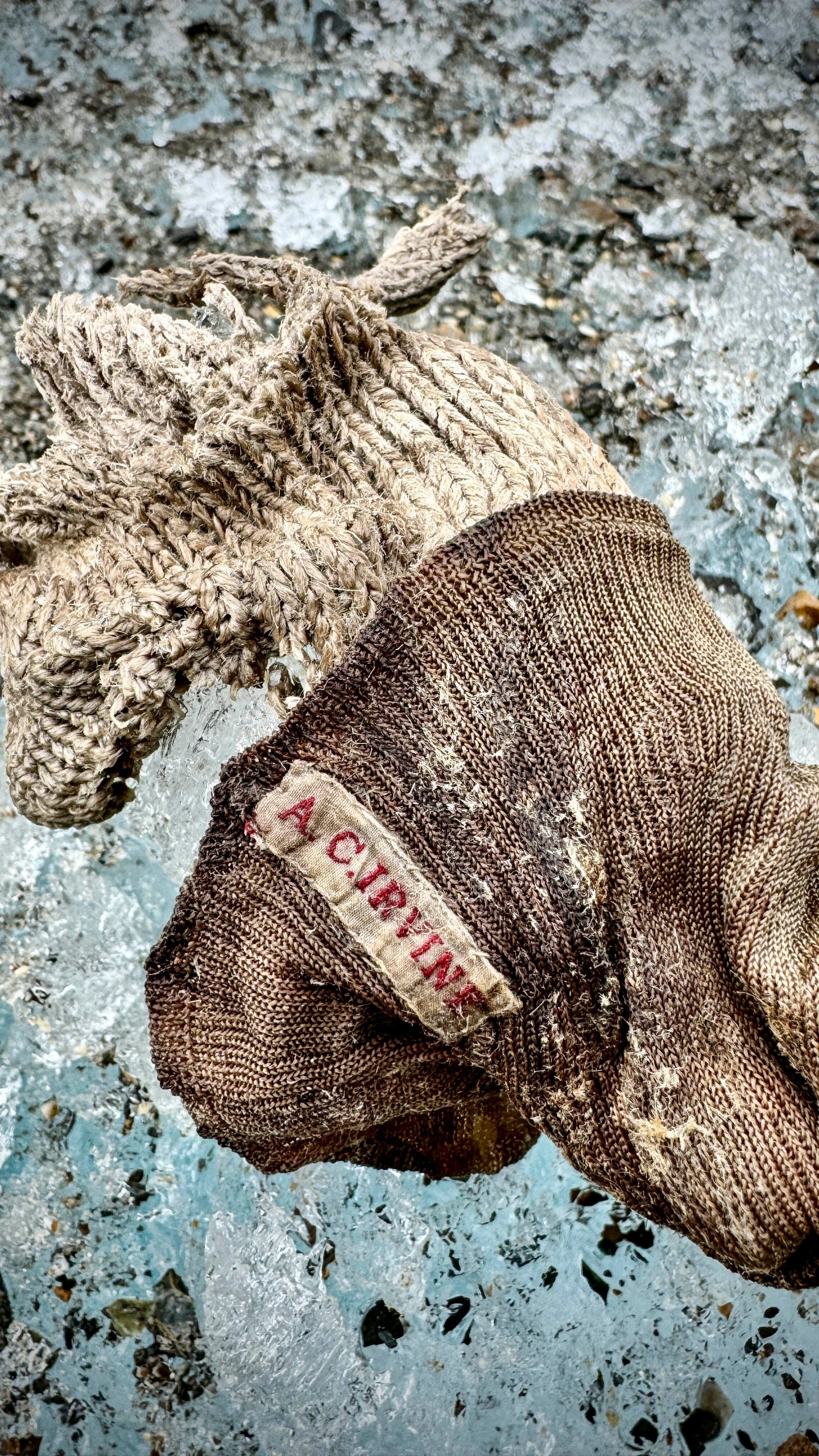 In this photo provided by National Geographic on Friday, Oct. 11, 2024, a sock embroidered with "A.C. Irvine", along with a boot, discovered on the Central Rongbuk Glacier below the North Face of Mount Everest by a team led by Jimmy Chin. (Jimmy Chin/National Geographic via AP)