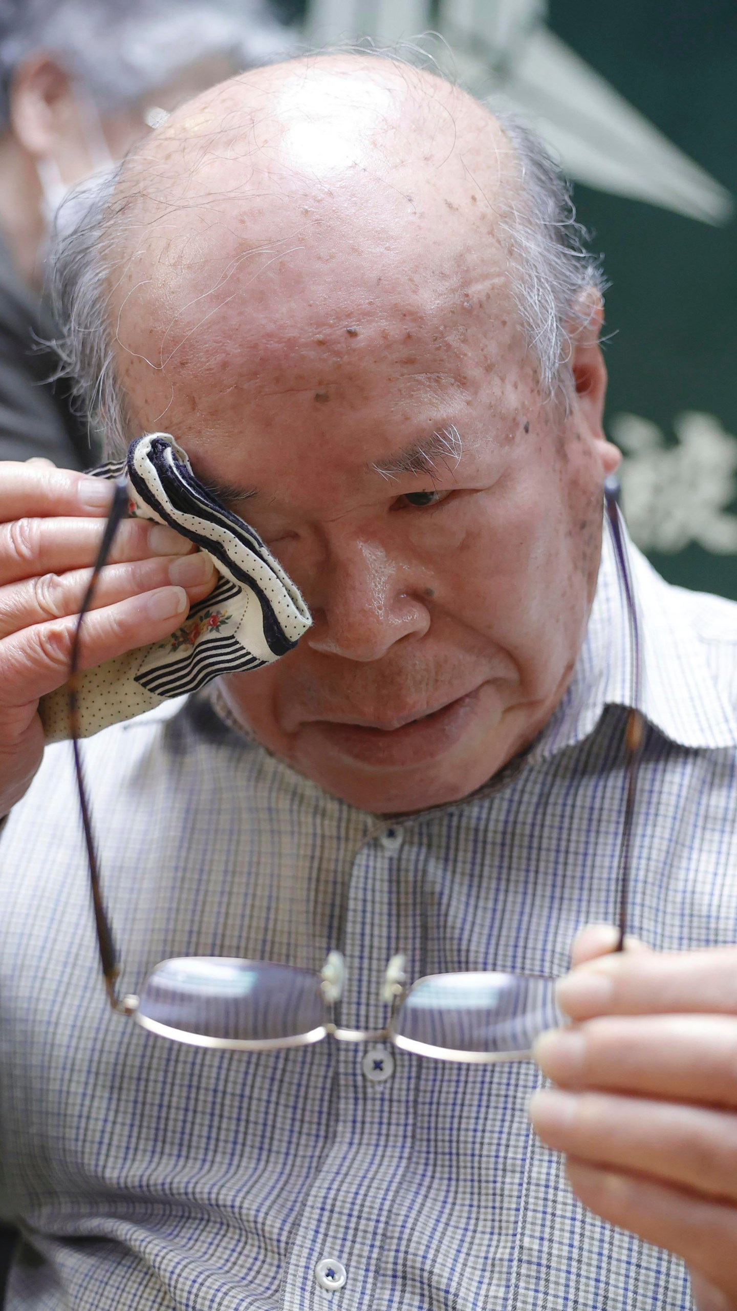 Shigemitsu Tanaka, the chairman of Nagasaki Atomic bomb Survivors Council, cries during a press conference, in Nagasaki, western Japan, Friday, Oct. 11, 2024, after Nihon Hidankyo, or the Japan Confederation of A- and H-Bomb Sufferers Organizations, won the Nobel Peace Prize.(Kyodo News via AP)