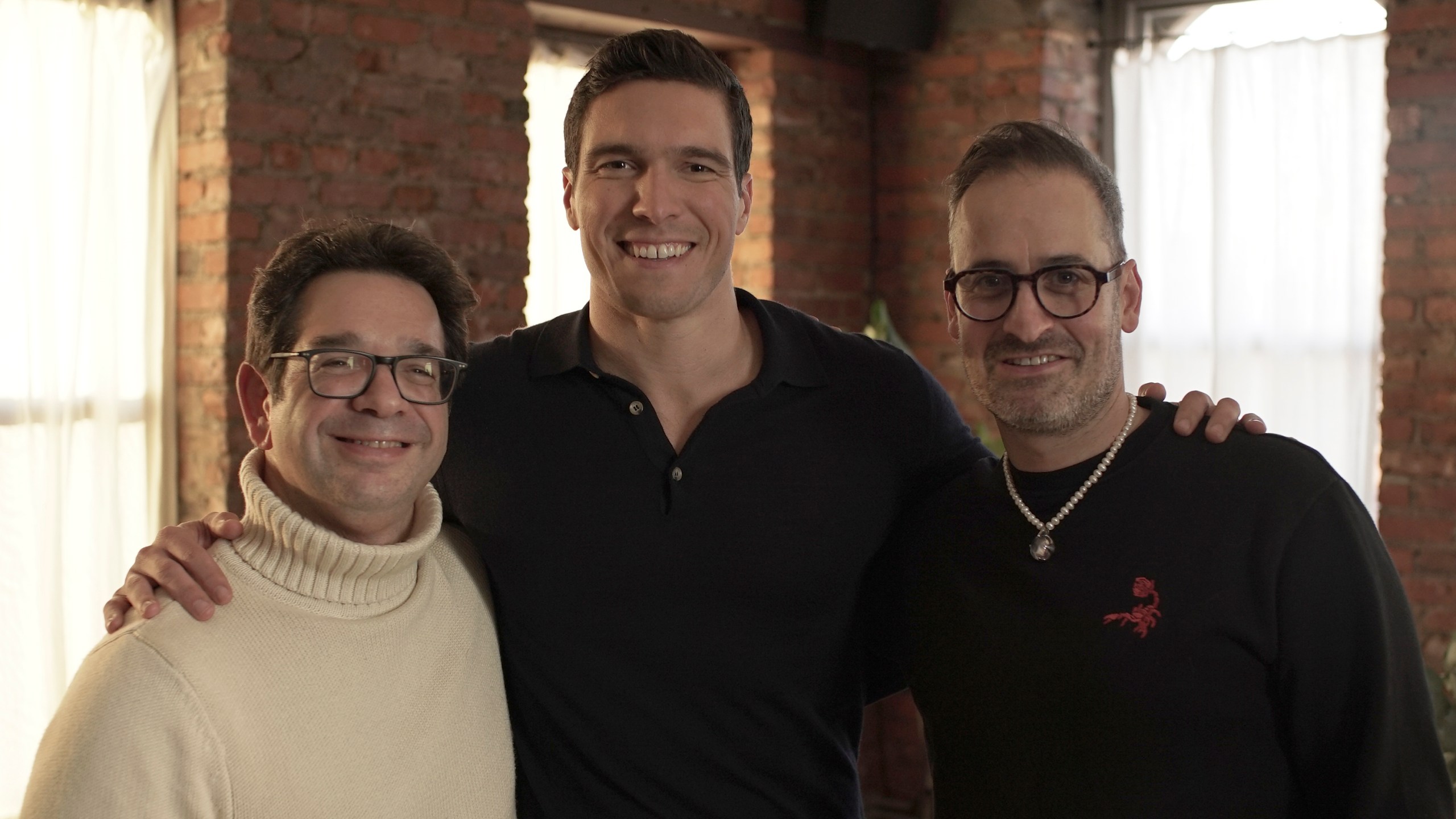 This image released by Warner Bros. Pictures shows director Peter Ettedgui, left, Will Reeve, center, and director Ian Bonhote, during the filming of the documentary "Super/Man: The Christopher Reeve Story." (Warner Bros. Pictures via AP)