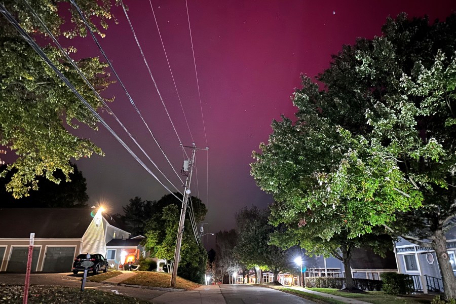 An aurora borealis, also known as the northern lights, shines over Portsmouth, N.H., Thursday, Oct. 10, 2024. (AP Photo/Caleb Jones)