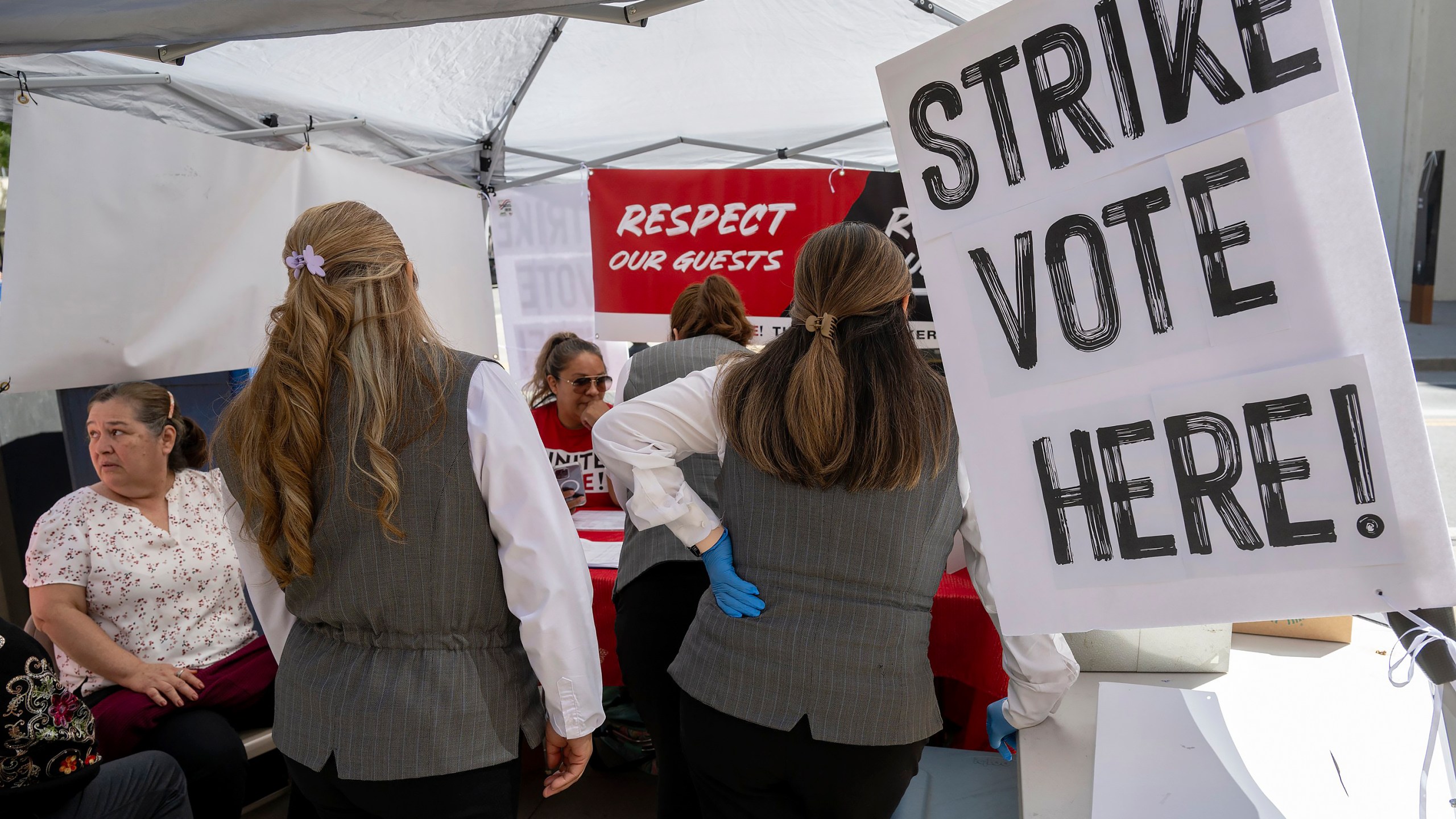 Sheraton Grand Hotel workers represented by United Here Local 49, a union that represents hospitality workers, participate in a strike authorization vote in Sacramento, Calif., Wednesday, Sept. 11, 2024. The union is asking for higher wages and the reversal of COVID-era staffing cuts. (Paul Kitagaki Jr./Sacramento Bee via AP)