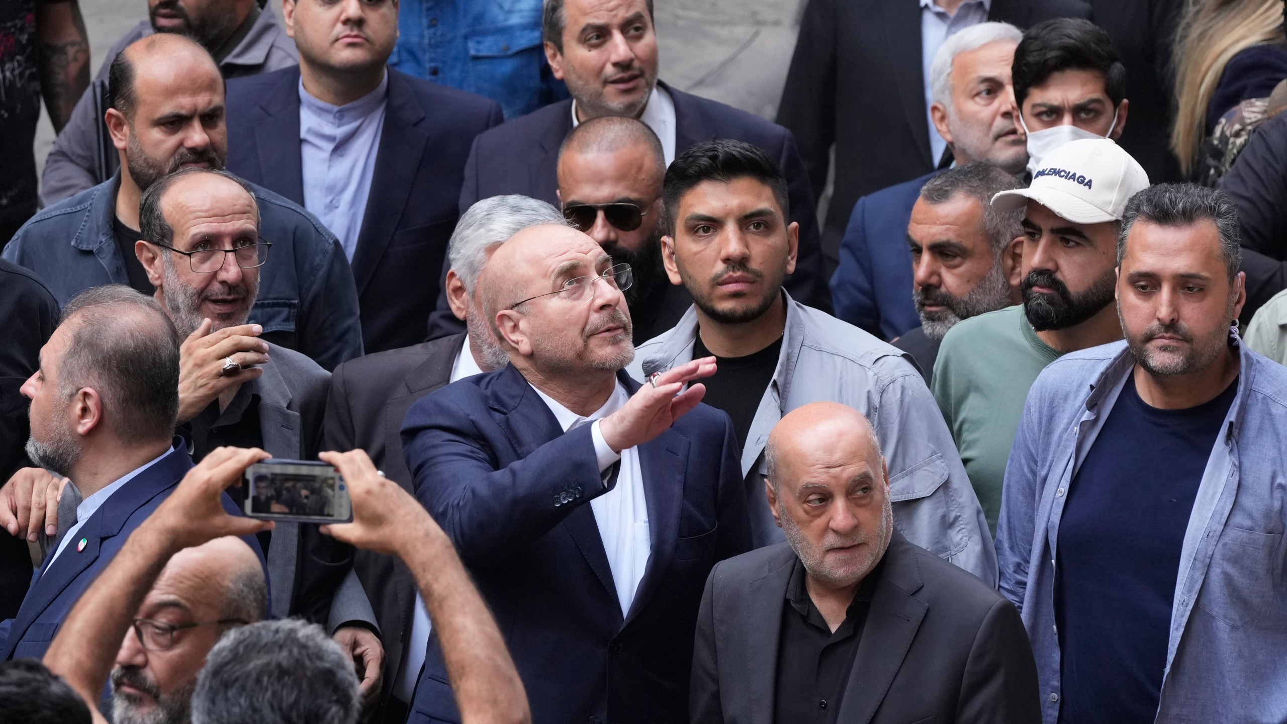 Iran's parliament speaker Mohammad Bagher Qalibaf, center, visits the site of Thursday's Israeli airstrike in Beirut, Lebanon, Saturday, Oct. 12, 2024. (AP Photo/Hassan Ammar)