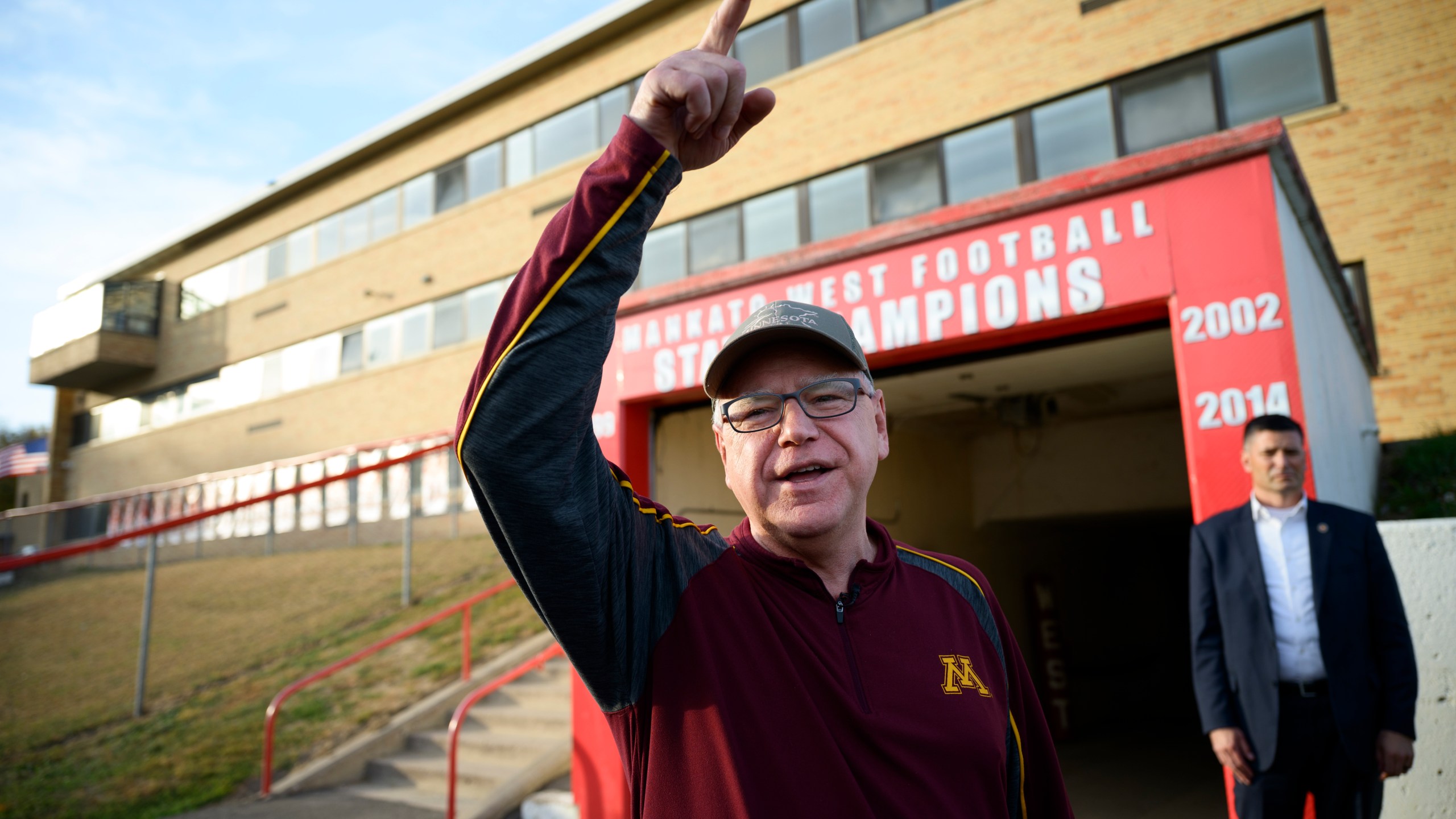 Vice Presidential candidate and Minnesota Gov. Tim Walz greets people in the football team tunnel Friday, Oct. 11, 2024 at Mankato West High School in Mankato, Minn. Gov. Walz visited Friday's Mankato East-West rivalry game. Walz was a defensive coach for Mankato West's 1999 state championship team. (Aaron Lavinsky/Star Tribune via AP)