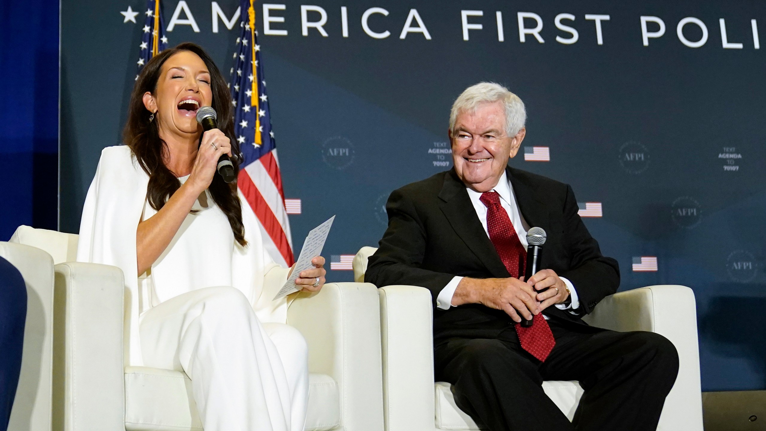 FILE - Brooke Rollins, former director of the White House Domestic Policy Council, speaks as former House Speaker Newt Gingrich listens at an America First Policy Institute agenda summit in Washington, July 26, 2022. (AP Photo/Andrew Harnik, File)