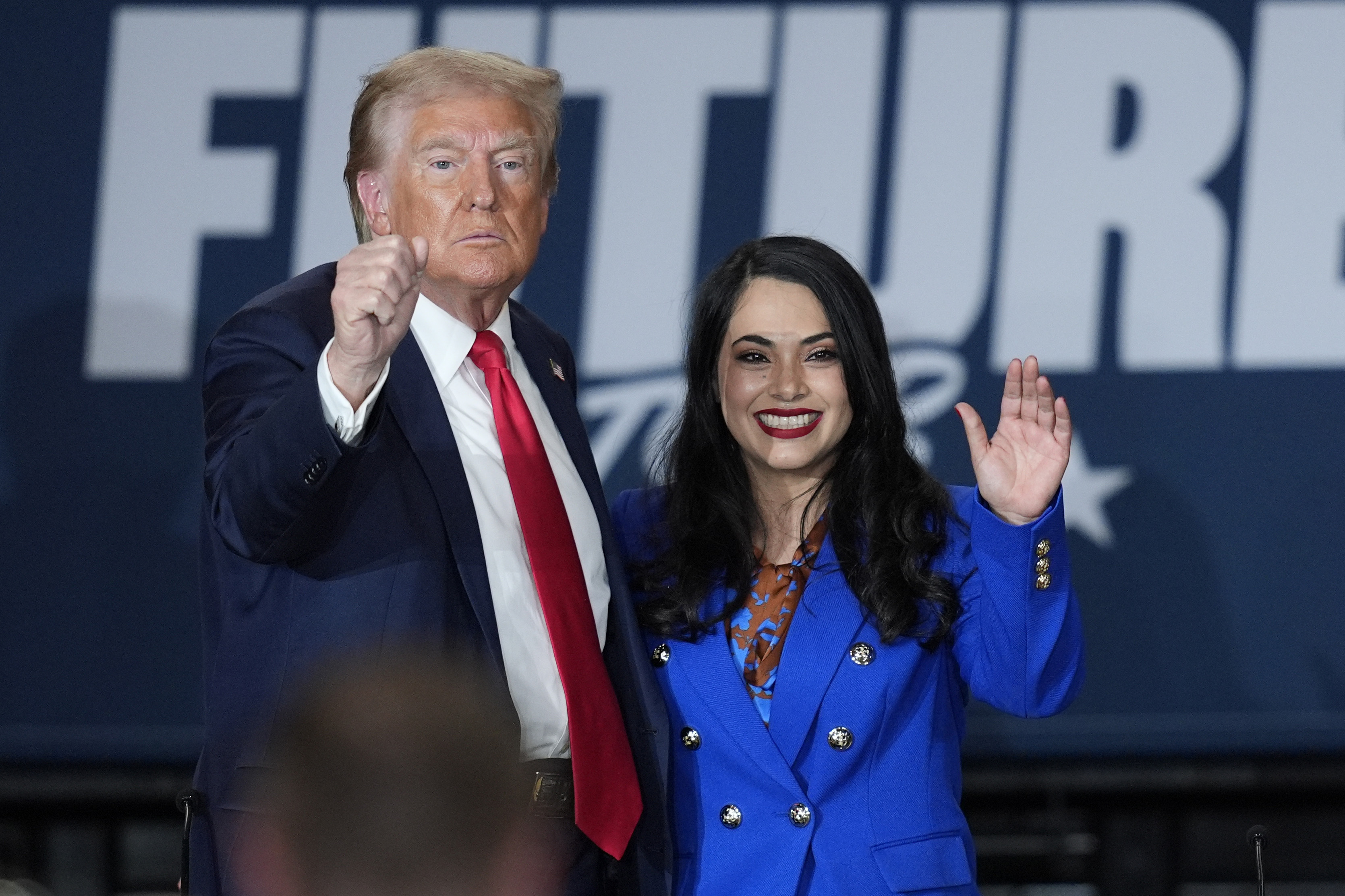 Republican presidential nominee former President Donald Trump, left, poses with Republican House candidate Mayra Flores at a campaign event at Beauty Society, Saturday, Oct. 12, 2024, in North Las Vegas, Nev. (AP Photo/John Locher)