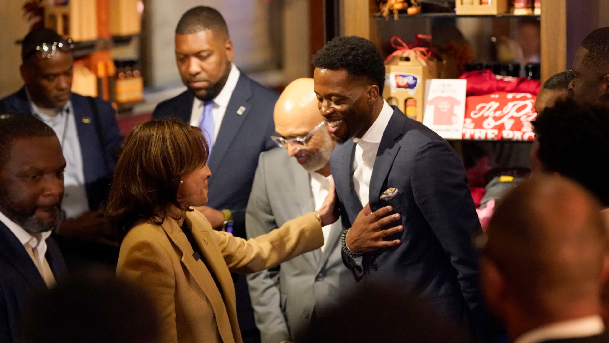 Democratic presidential nominee Vice President Kamala Harris, left, greets guests as she visits The Pit Authentic Barbecue to learn about the restaurant's relief efforts for Hurricane Helene, in Raleigh, N.C., Saturday, Oct. 12, 2024. (AP Photo/Steve Helber)