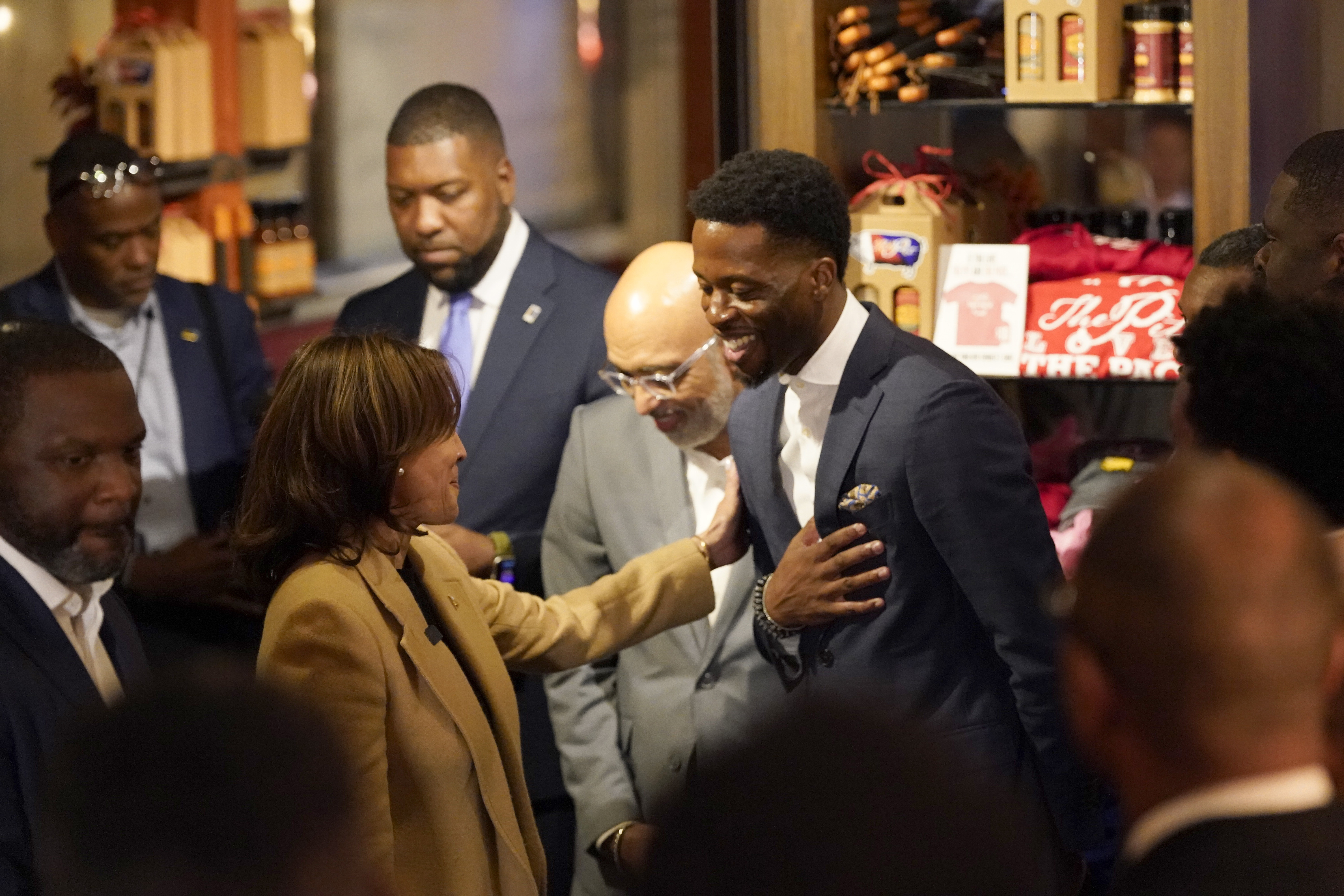 Democratic presidential nominee Vice President Kamala Harris, left, greets guests as she visits The Pit Authentic Barbecue to learn about the restaurant's relief efforts for Hurricane Helene, in Raleigh, N.C., Saturday, Oct. 12, 2024. (AP Photo/Steve Helber)