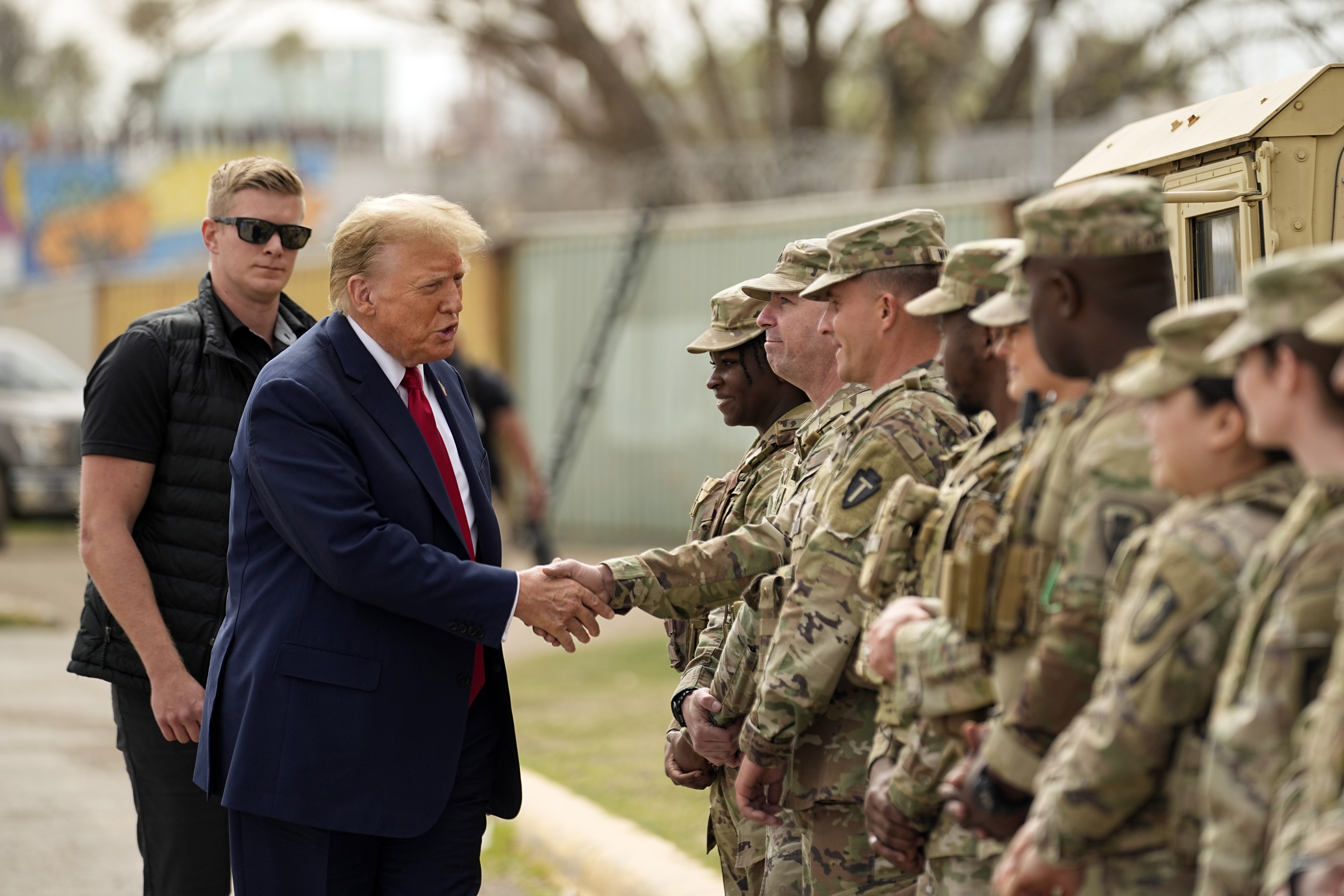 FILE - Republican presidential candidate former President Donald Trump greets members of the National Guard on the U.S.-Mexico border, Feb. 29, 2024, in Eagle Pass, Texas. (AP Photo/Eric Gay, File)