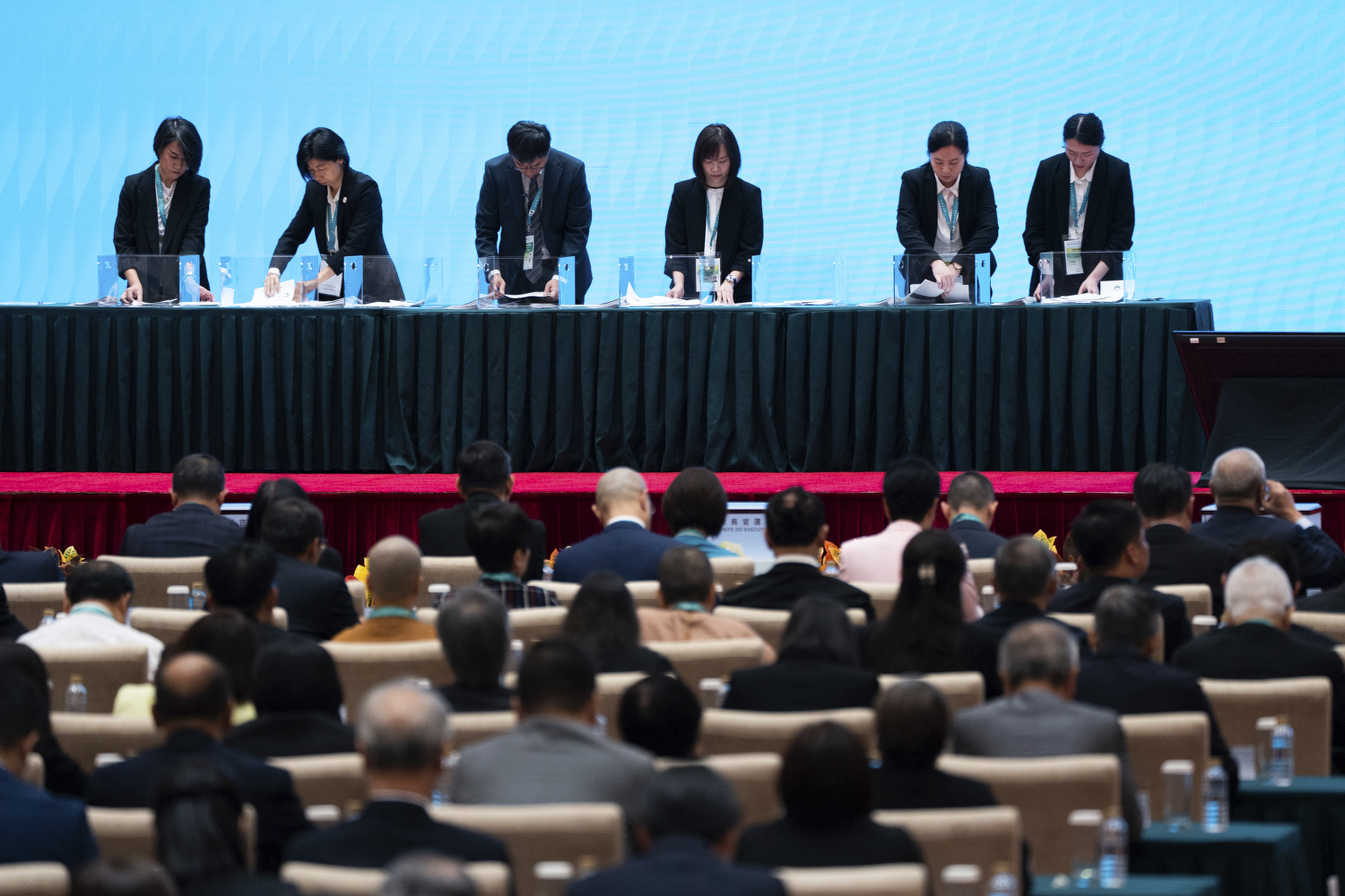 Staff count the votes during the chief executive election in Macao, Sunday, Oct. 13, 2024. (AP Photo/Bertha Wang)