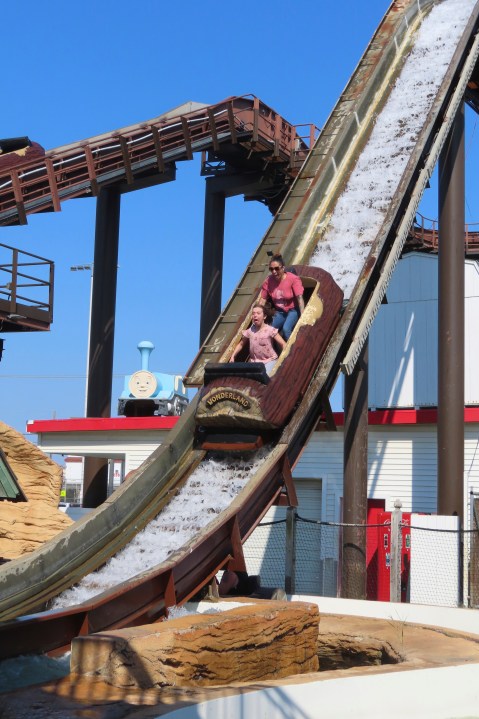 People ride the log flume at Gillian's Wonderland, the popular amusement park on the boardwalk in the Ocean City, N.J., during its final day of operation before shutting down for good, Sunday, Oct. 13, 2024. (AP Photo/Wayne Parry)