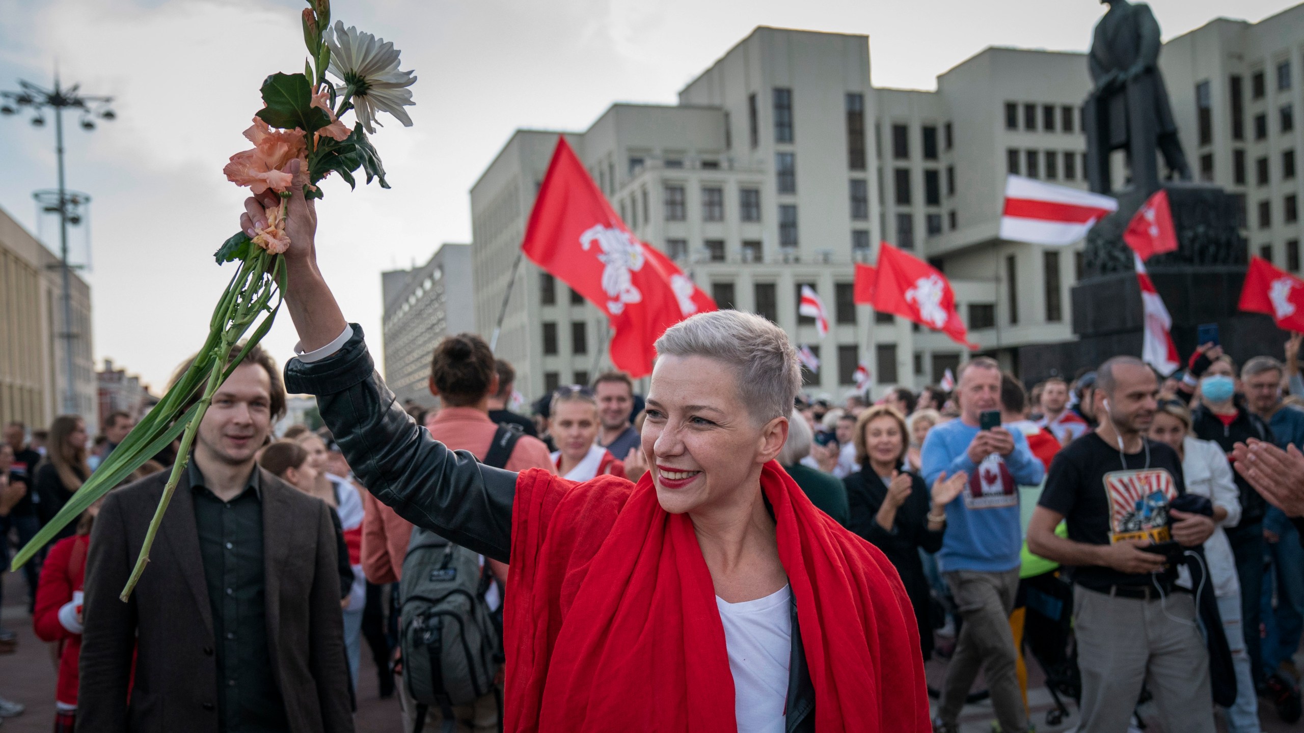 FILE – Opposition activist Maria Kolesnikova greets protesters at a rally in front of a government building in Independence Square in Minsk, Belarus, on Aug. 22, 2020. (AP Photo/Evgeniy Maloletka, File)