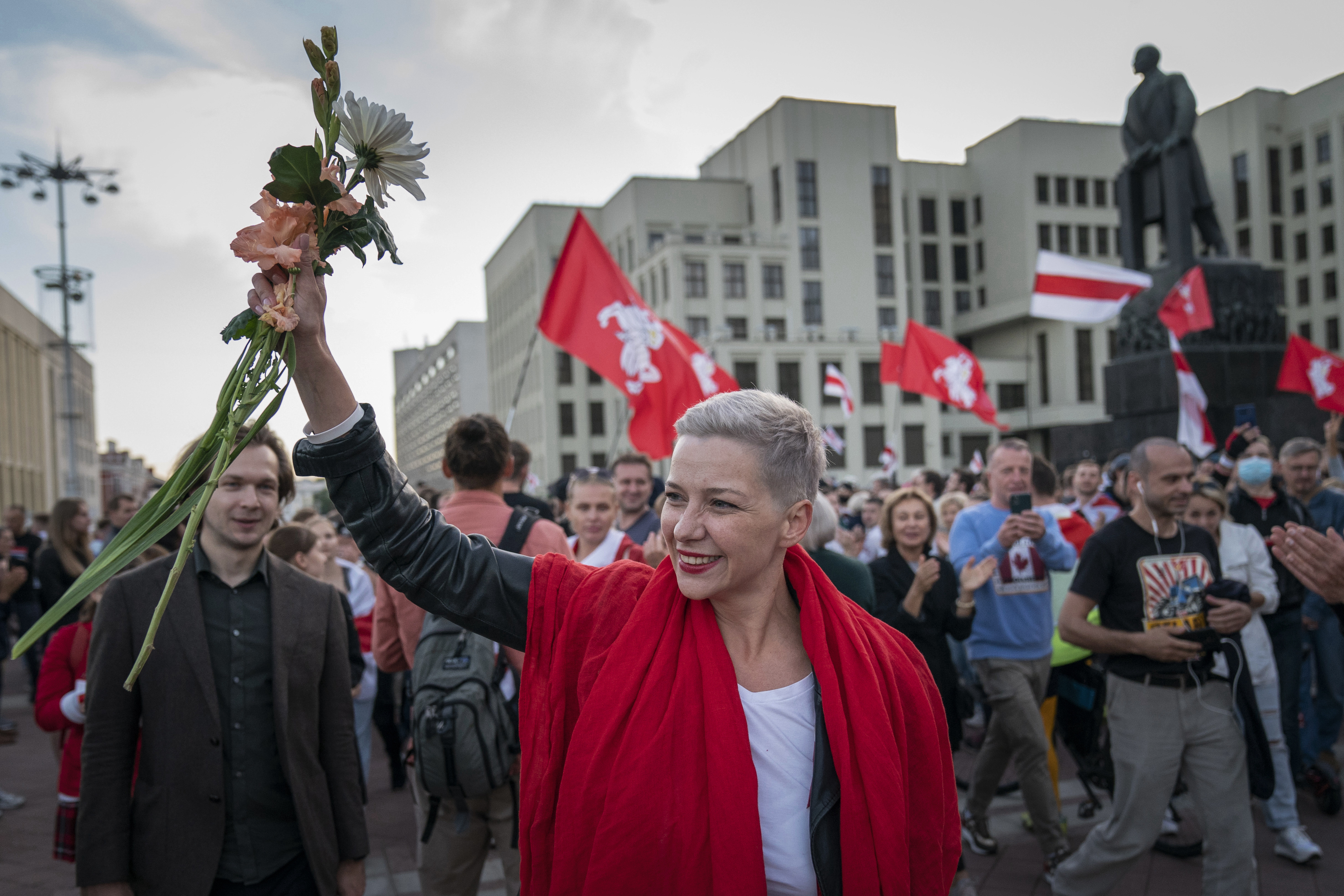 FILE – Opposition activist Maria Kolesnikova greets protesters at a rally in front of a government building in Independence Square in Minsk, Belarus, on Aug. 22, 2020. (AP Photo/Evgeniy Maloletka, File)