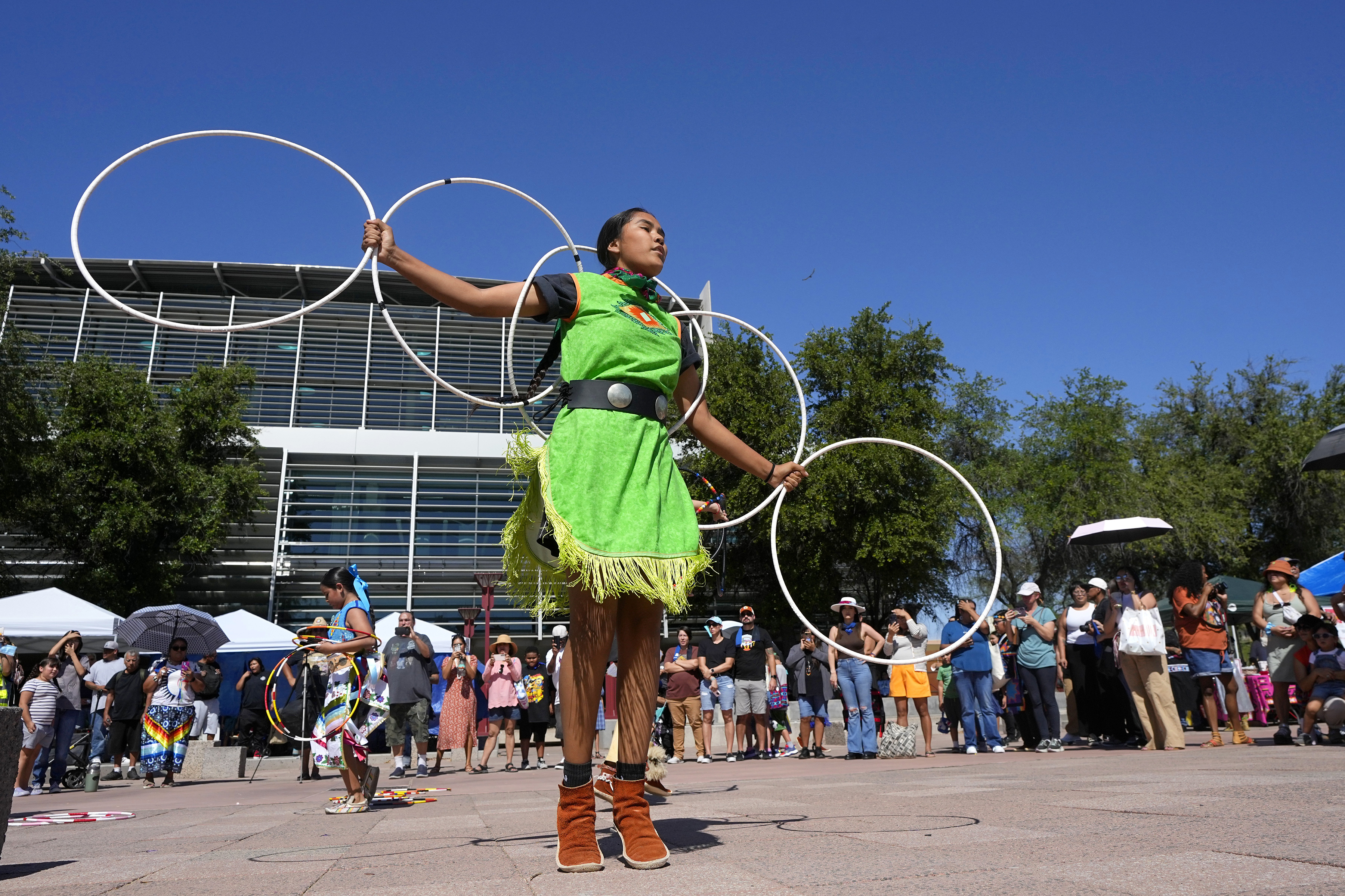 FILE - Performers from the Native American Hoop Dance of Ballet Arizona dance at an Indigenous Peoples Day festival, Oct. 9, 2023, in Phoenix. (AP Photo/Ross D. Franklin, File)