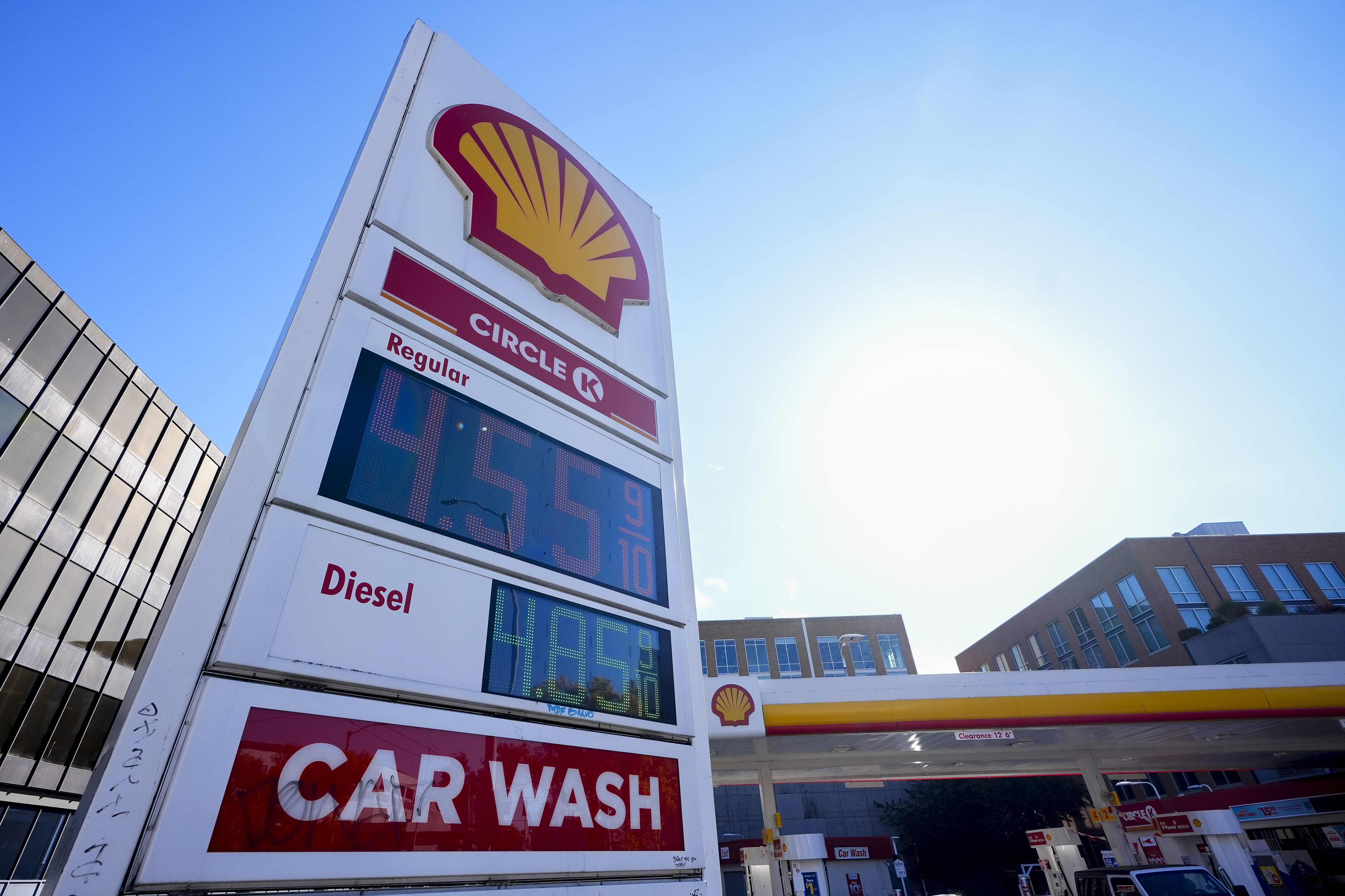 Prices are displayed on a corner sign at a Shell gas station, Wednesday, Oct. 9, 2024, in Seattle. (AP Photo/Lindsey Wasson)