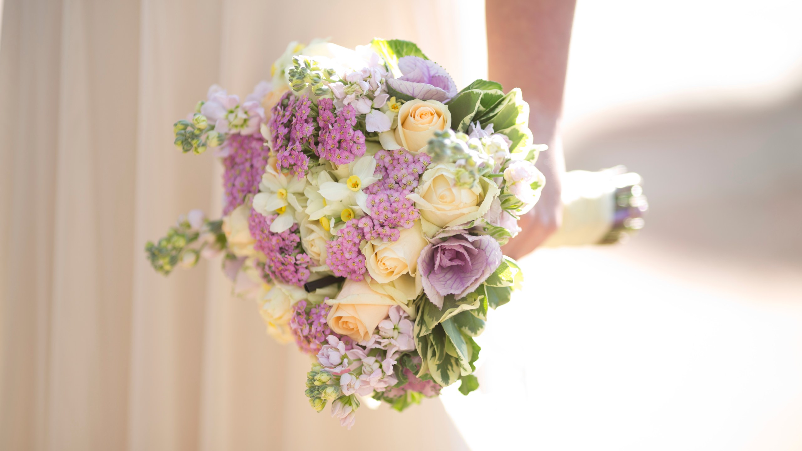 FILE - A bride holds a bouquet during her wedding in Ein Hemed, Israel on Dec. 14, 2017. (AP Photo/Ariel Schalit, File)