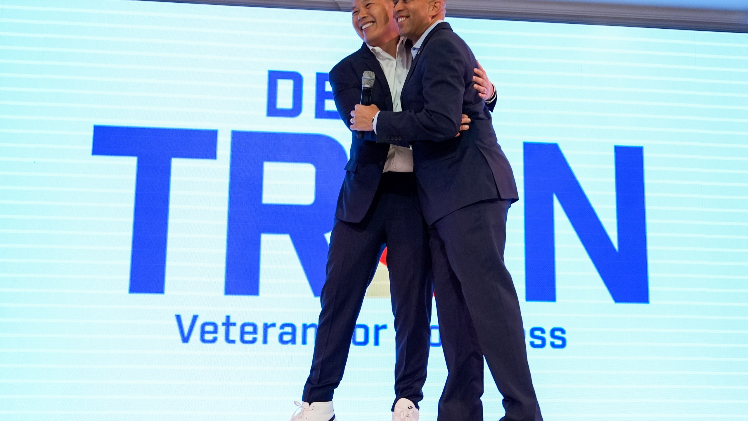 House Minority Leader Hakeem Jeffries, D-N.Y., greets Derek Tran during a campaign event at Golden Sea Restaurant, Saturday, Oct. 12, 2024, in Anaheim, Calif. (AP Photo/Julia Demaree Nikhinson)