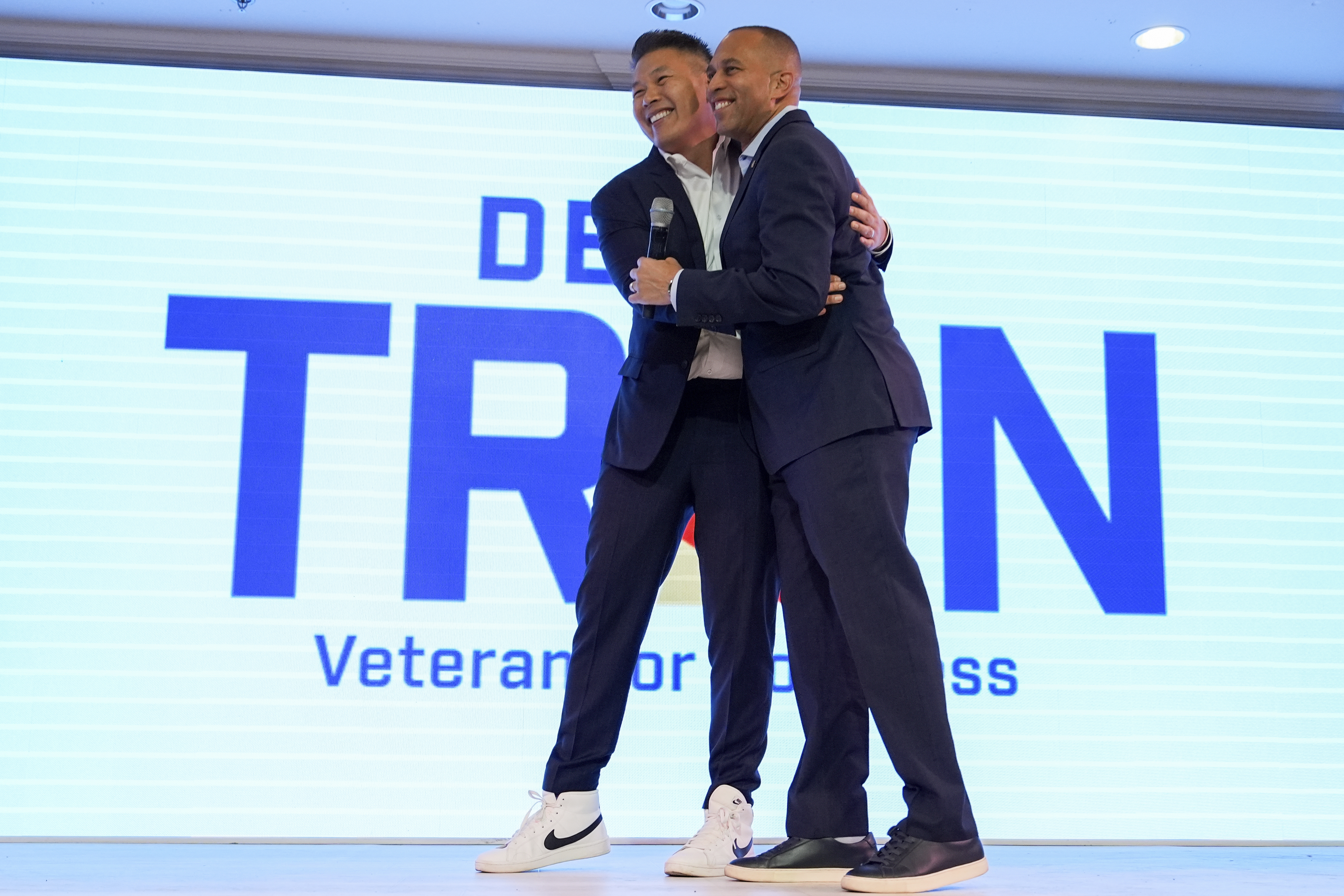 House Minority Leader Hakeem Jeffries, D-N.Y., greets Derek Tran during a campaign event at Golden Sea Restaurant, Saturday, Oct. 12, 2024, in Anaheim, Calif. (AP Photo/Julia Demaree Nikhinson)