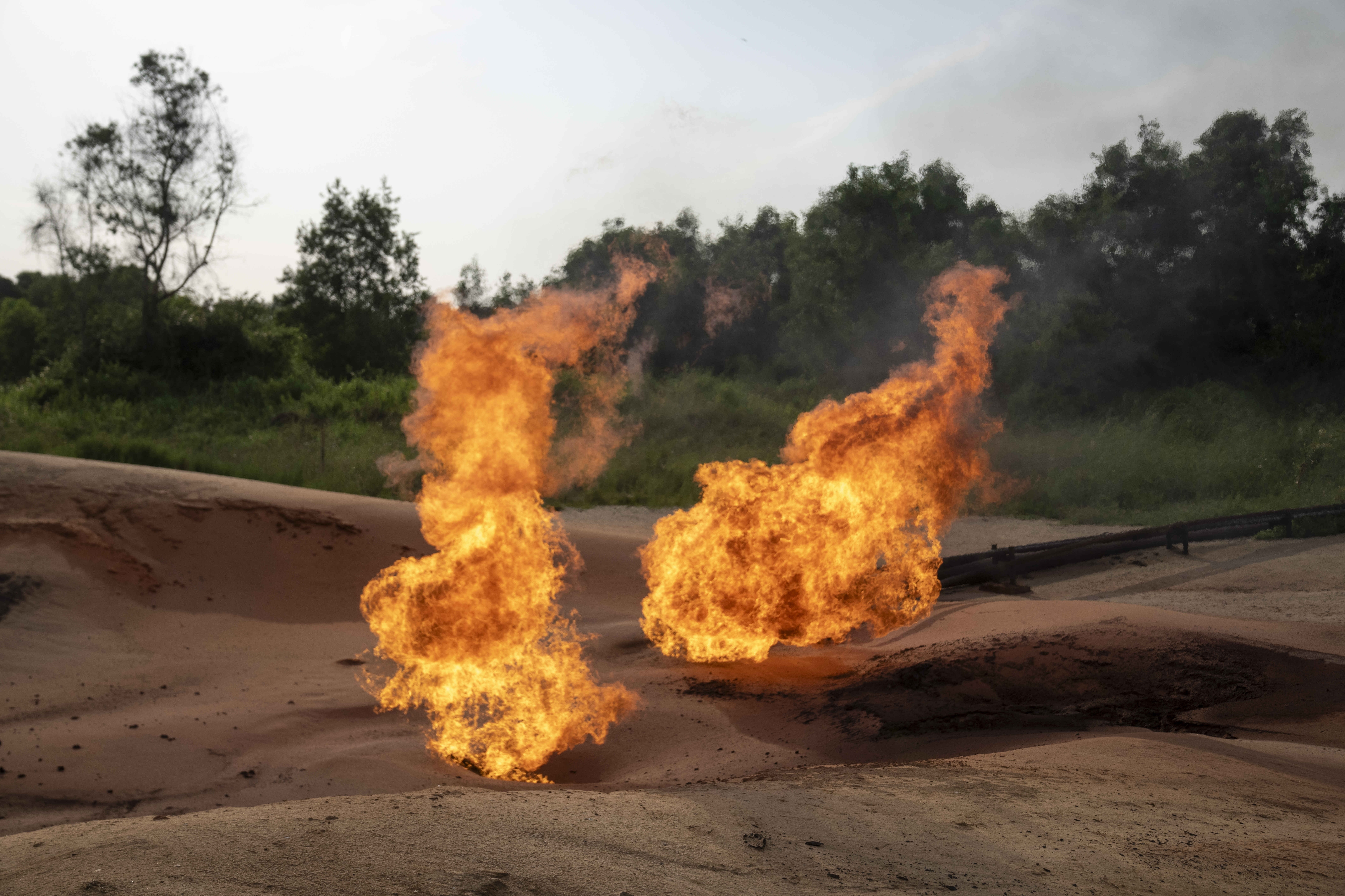 FILE—A burning flare is visible at an oil extraction area located in Moanda, Democratic Republic of the Congo, on Dec. 23, 2023. (AP Photo/Mosa'ab Elshamy, File)