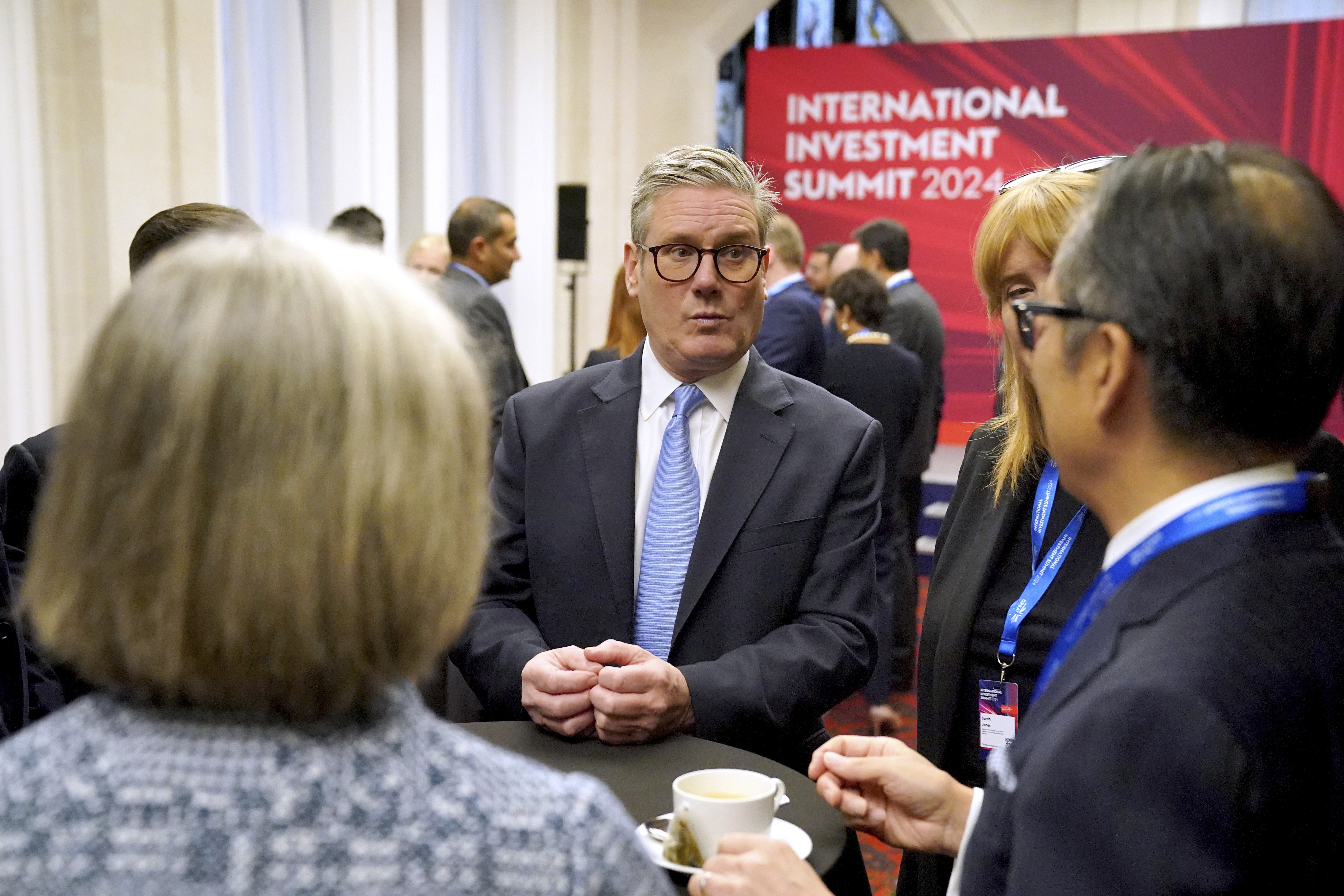 British Prime Minister Sir Keir Starmer, center, speaks with leaders from across the UK during the International Investment Summit in London, Monday, Oct. 14, 2024. (Jonathan Brady/Pool Photo via AP)