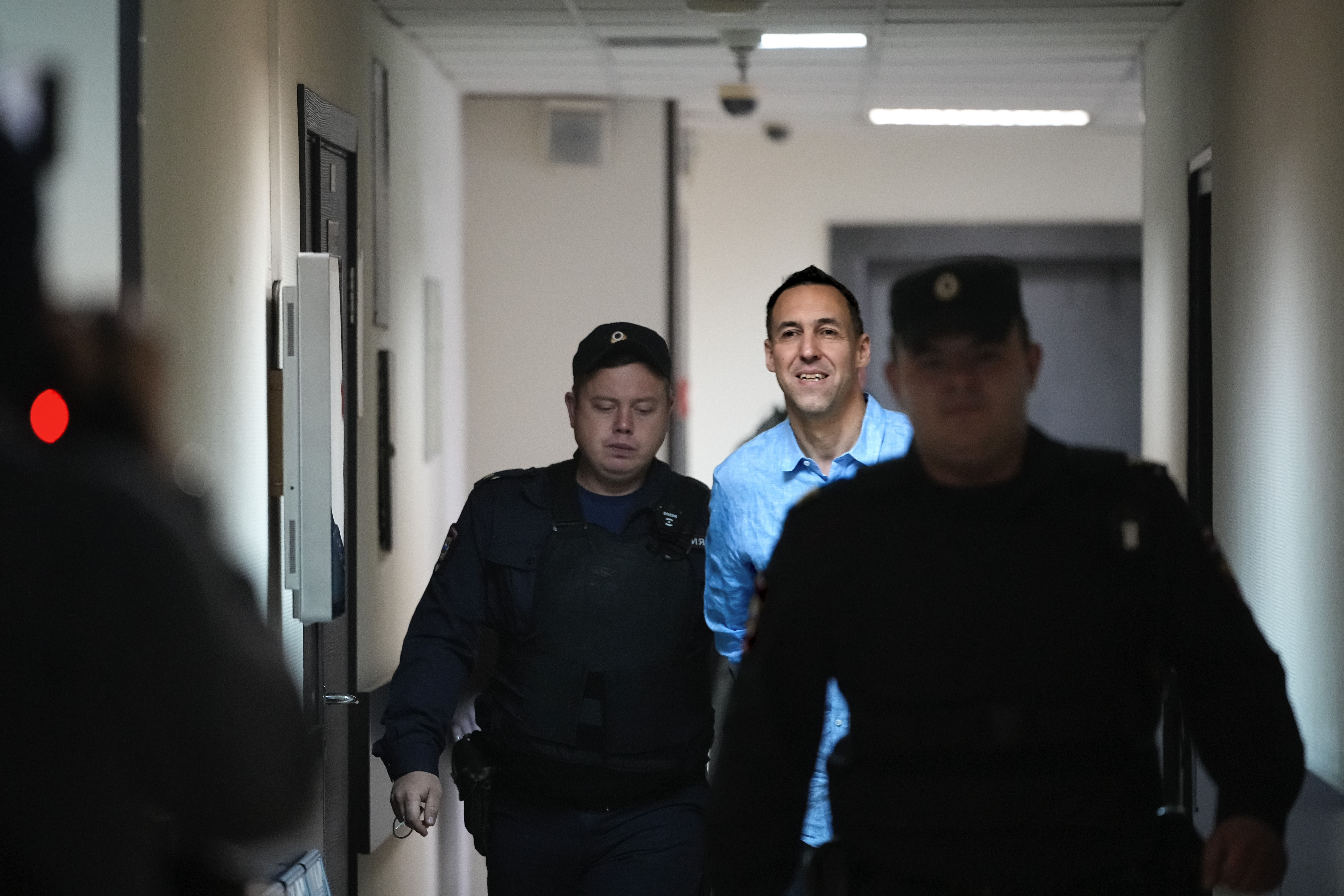 French citizen Laurent Vinatier is escorted to a court room at the Zamoskvoretsky District Court in Moscow, Russia, on Monday, Oct. 14, 2024. (AP Photo/Pavel Bednyakov)