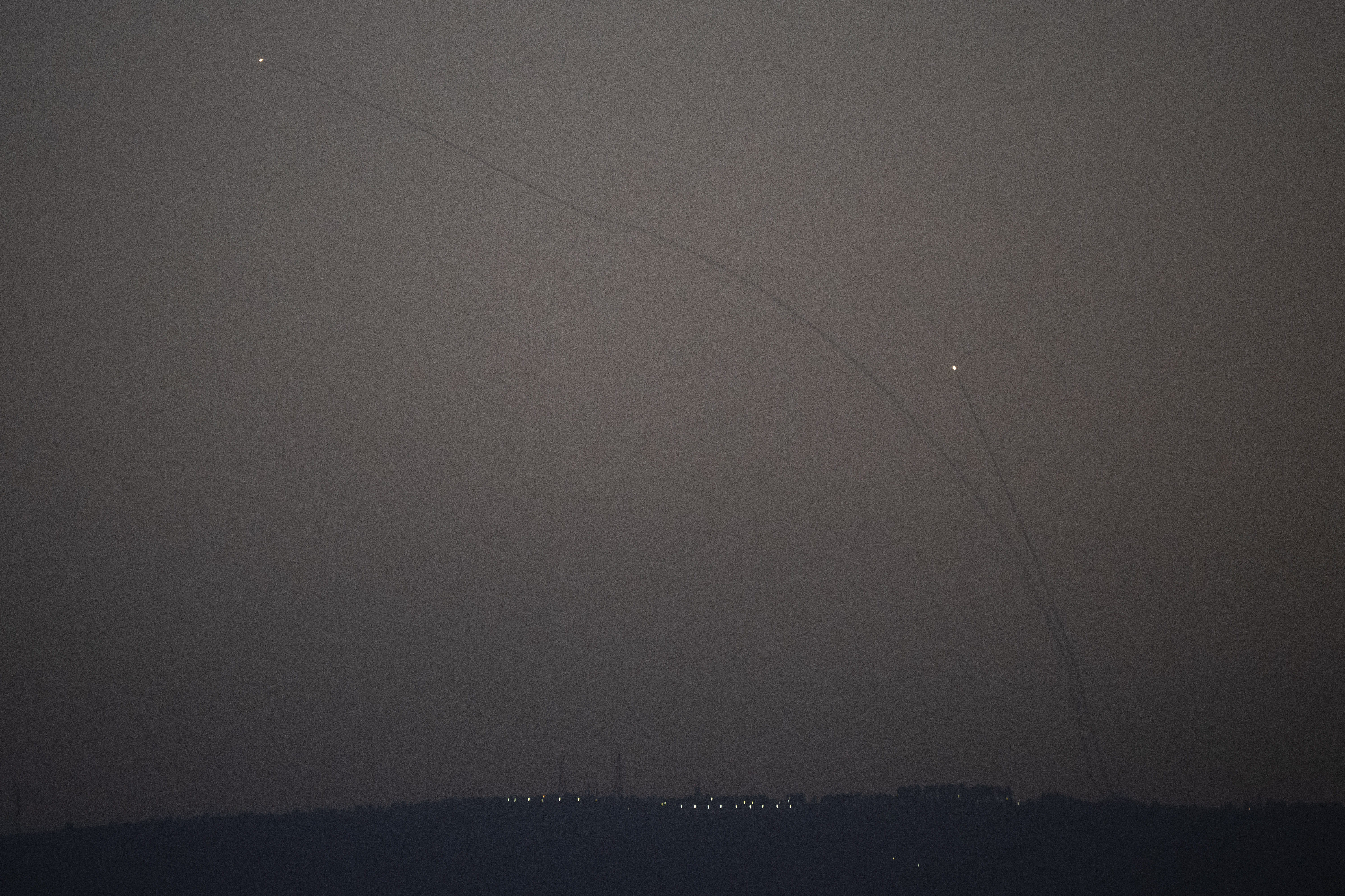 Israeli Iron Dome air defense system fires to intercept rockets that were launched from Lebanon, in northern Israel, Monday, Oct. 14, 2024. (AP Photo/Leo Correa)