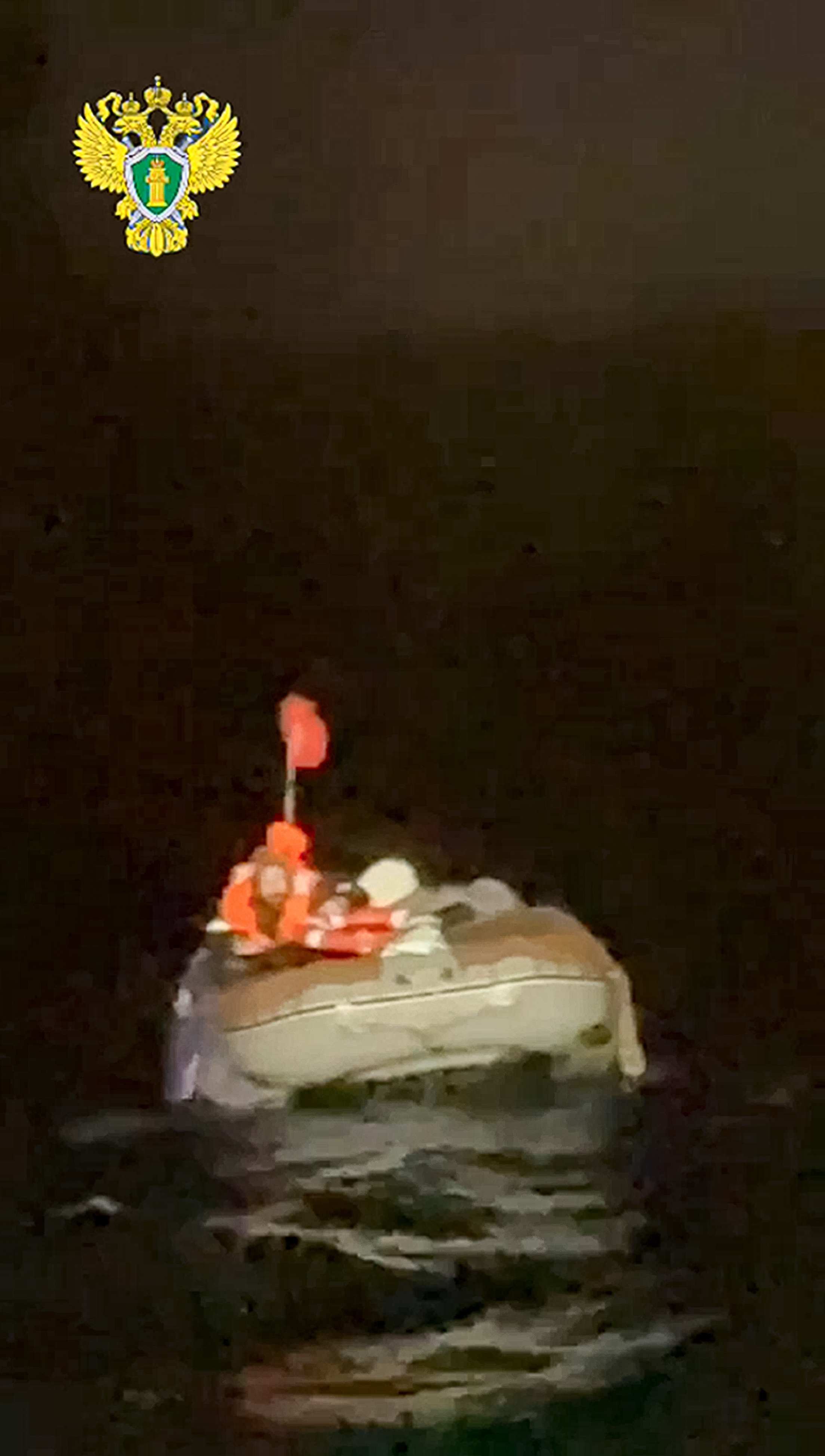 In this photo taken from video released by the official telegram channel of the Russian Far Eastern Transport Prosecutor's Office on Tuesday, Oct. 15, 2024, a Russian man who spent more than two months adrift in an inflatable boat is seen before being rescued by a fishing vessel in the Okhotsk Sea near the village of Ust-Khairuzovo in Kamchatka region of Russian far east. (Official telegram channel of the Russian Far Eastern Transport Prosecutor's Office via AP)