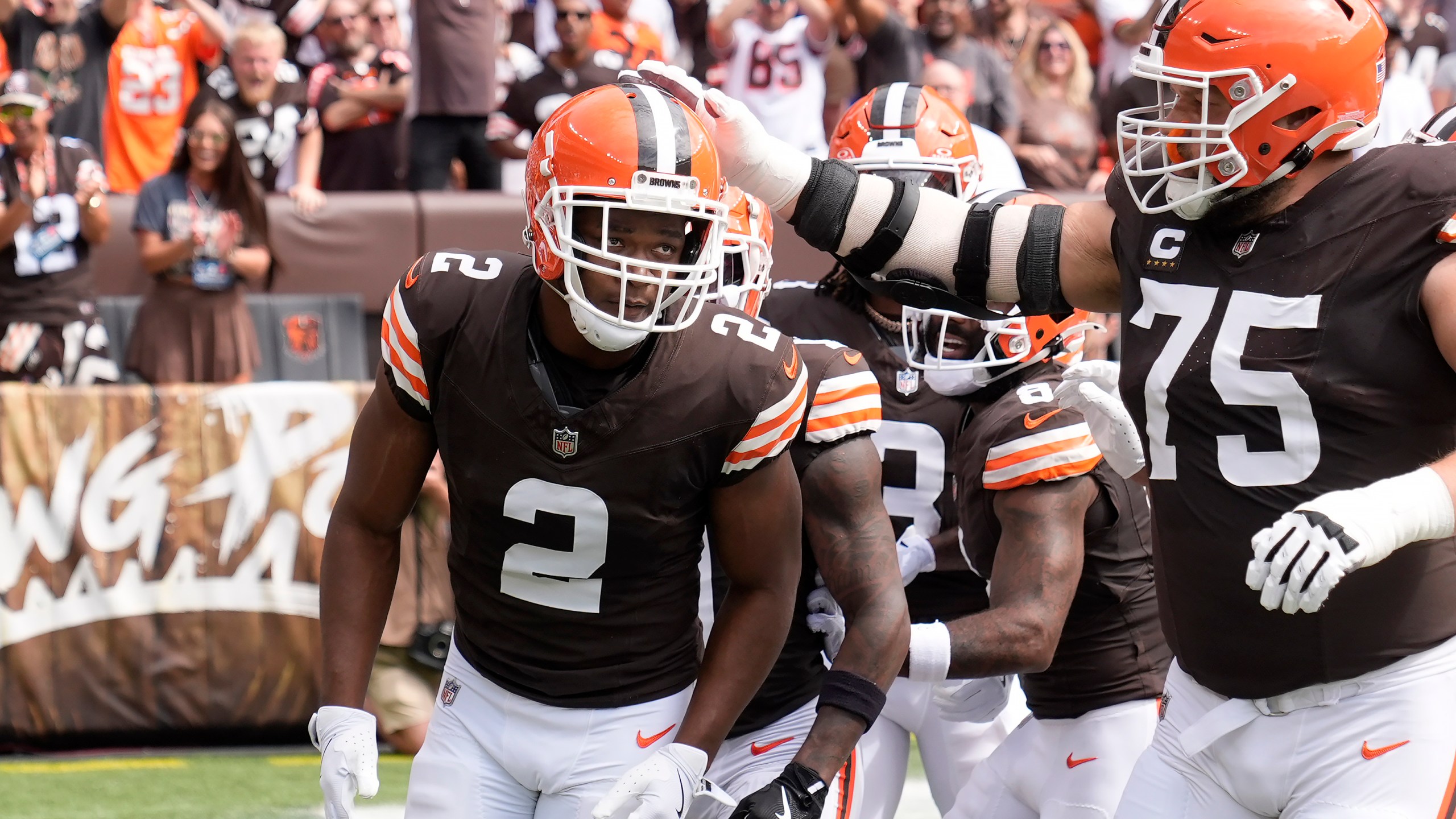 Cleveland Browns wide receiver Amari Cooper (2) is congratulated by guard Joel Bitonio (75) after scoring against the New York Giants during the first half of an NFL football game, Sunday, Sept. 22, 2024 in Cleveland. (AP Photo/Sue Ogrocki)