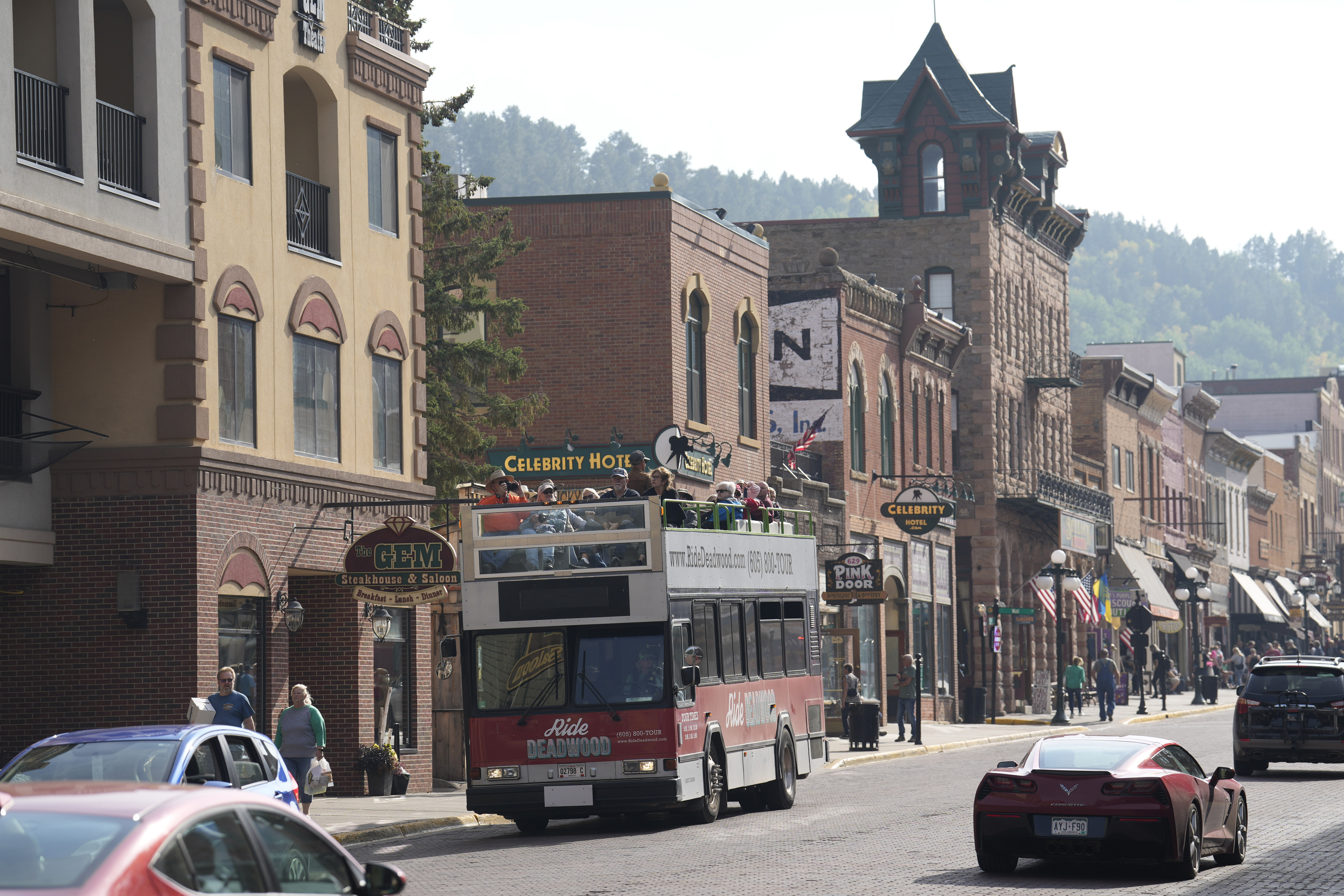 FILE - People walk along Main Street in Deadwood, S.D., Sept. 20, 2023. (AP Photo/David Zalubowski, File)