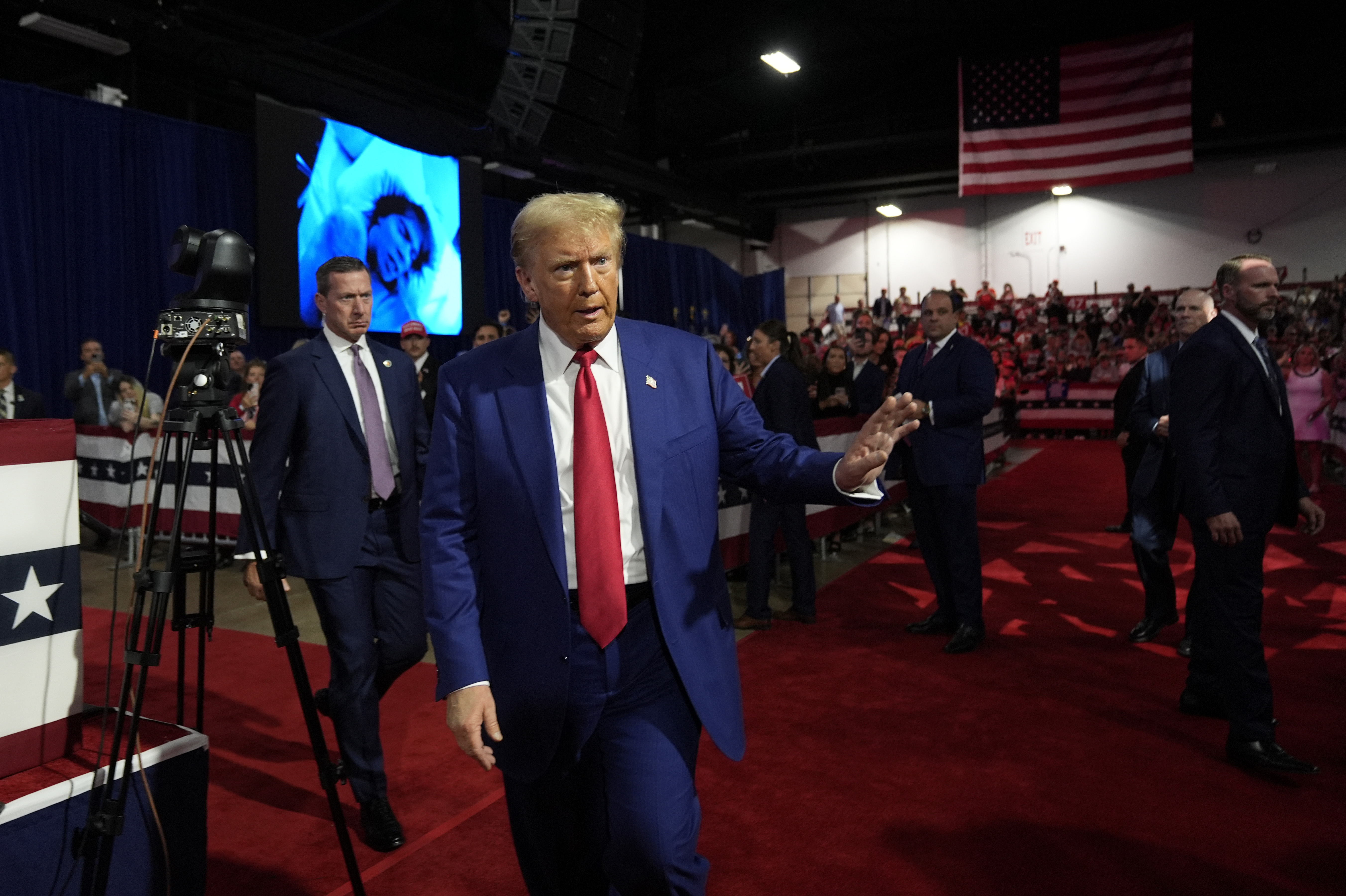 Republican presidential nominee former President Donald Trump waves to supporters at a campaign town hall at the Greater Philadelphia Expo Center & Fairgrounds, Monday, Oct. 14, 2024, in Oaks, Pa. (AP Photo/Alex Brandon)