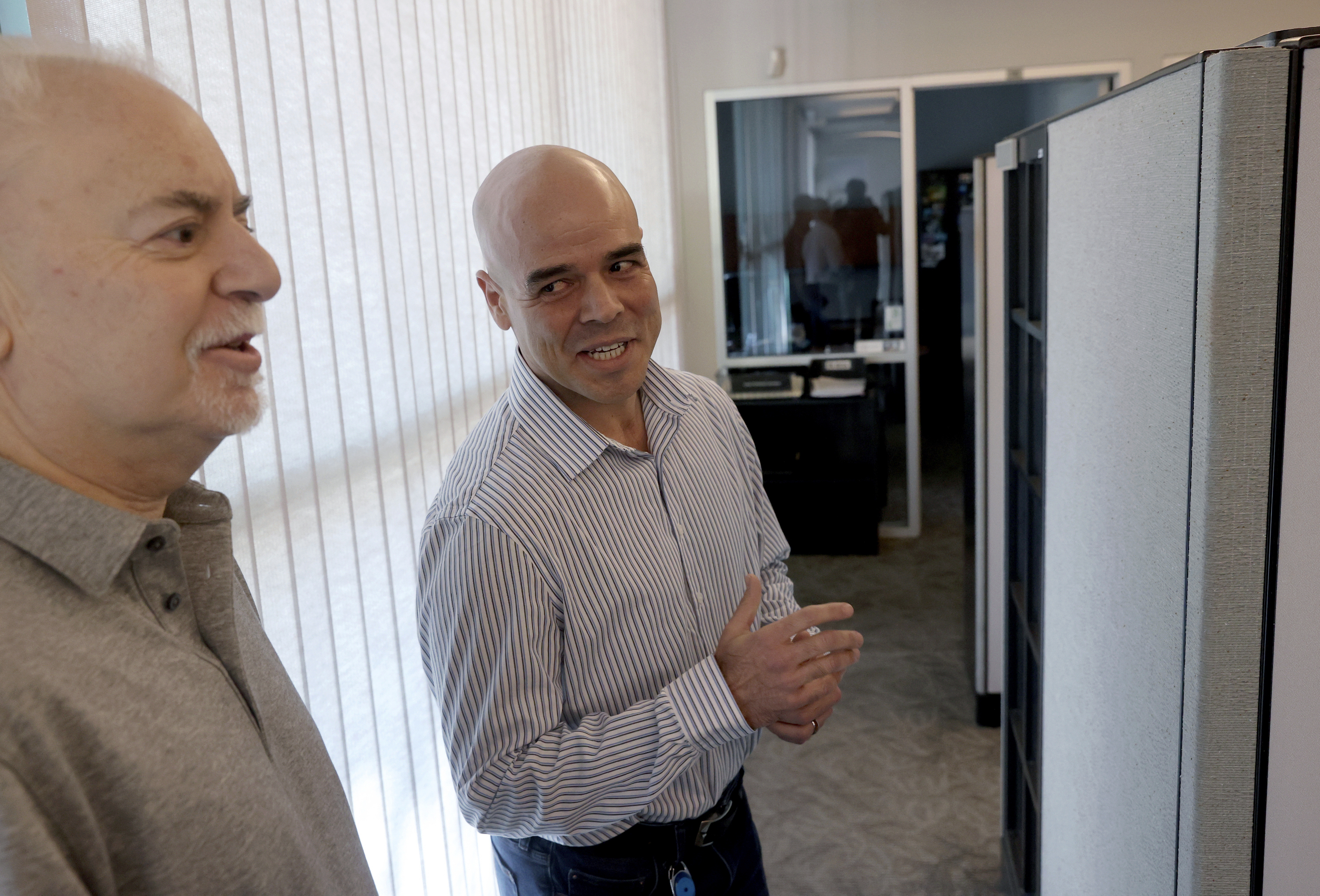 FILE - Clark County Public Administrator Robert Telles, right, talks to Las Vegas Review-Journal reporter Jeff German in his Las Vegas office, May 11, 2022. (K.M. Cannon/Las Vegas Review-Journal via AP, File)