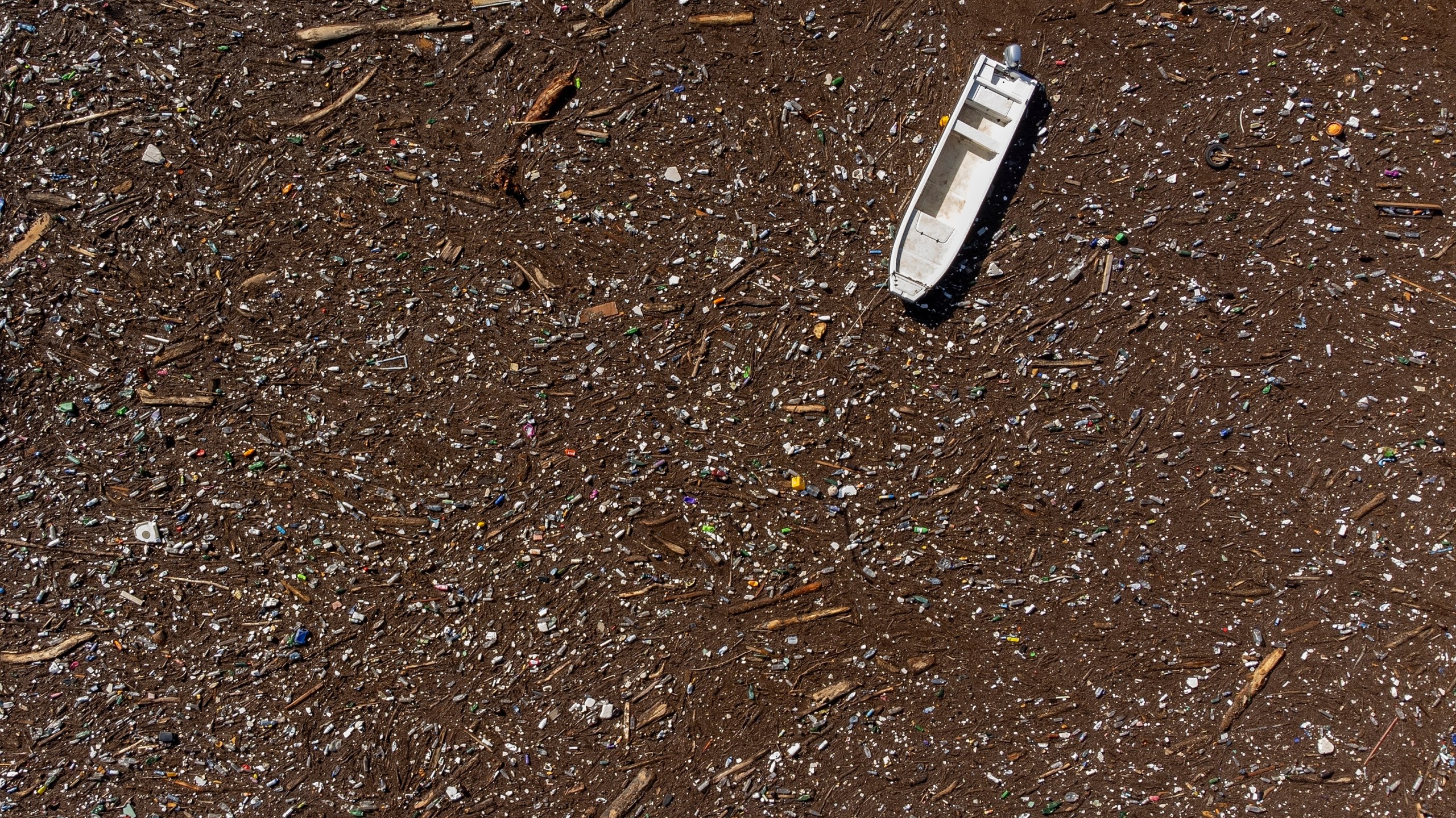 FILE - A boat is stuck near a dam on the Neretva River in Grabovica, Bosnia, Oct. 13, 2024. (AP Photo/Armin Durgut, File)