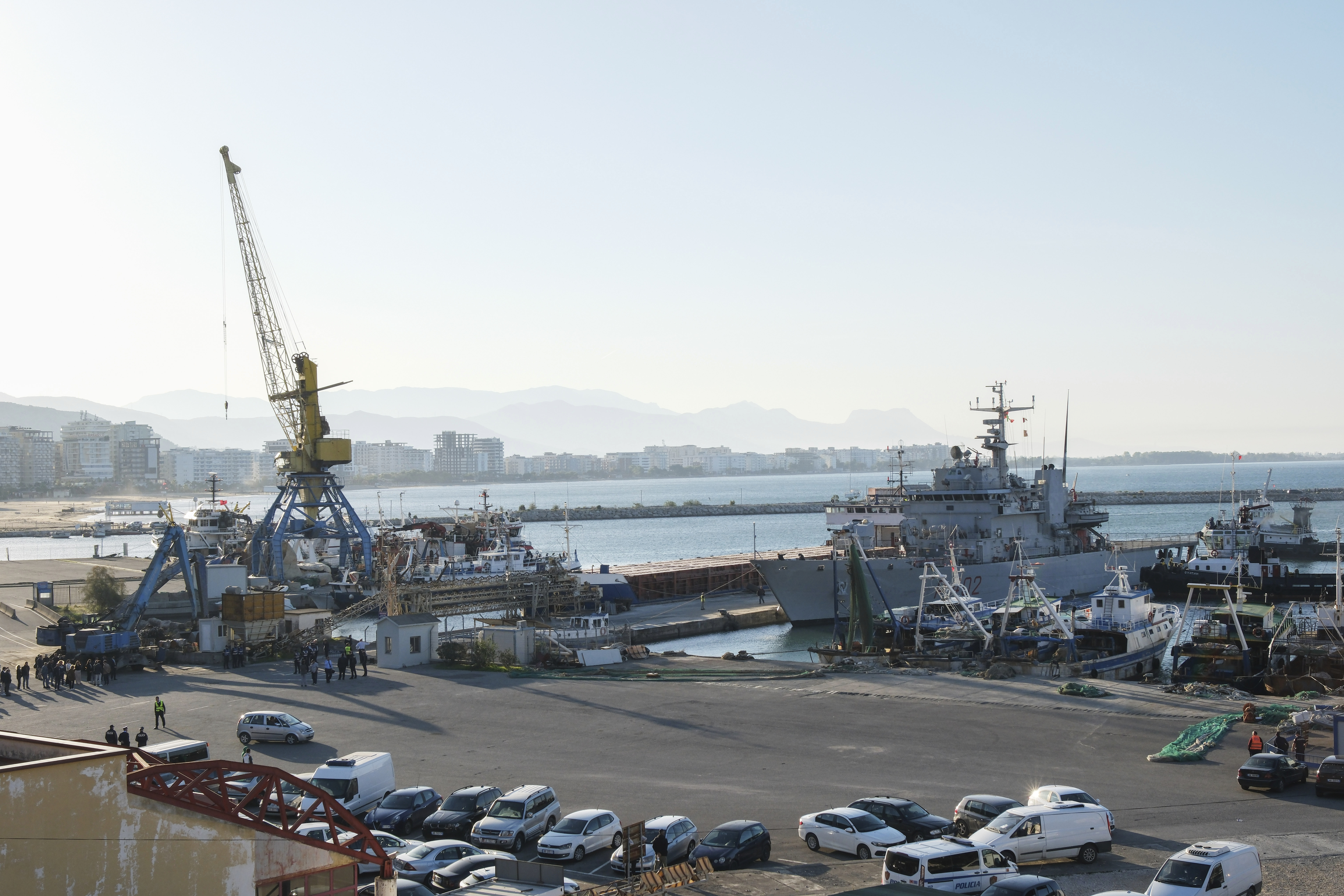 The Italian navy ship Libra is docked at Shengjin port northwestern Albania Wednesday, Oct. 16, 2024, carrying the first group of migrants who were intercepted in international waters and redirected to Albania in force of an agreement between the two counties.. (AP Photo/Vlasov Sulaj)