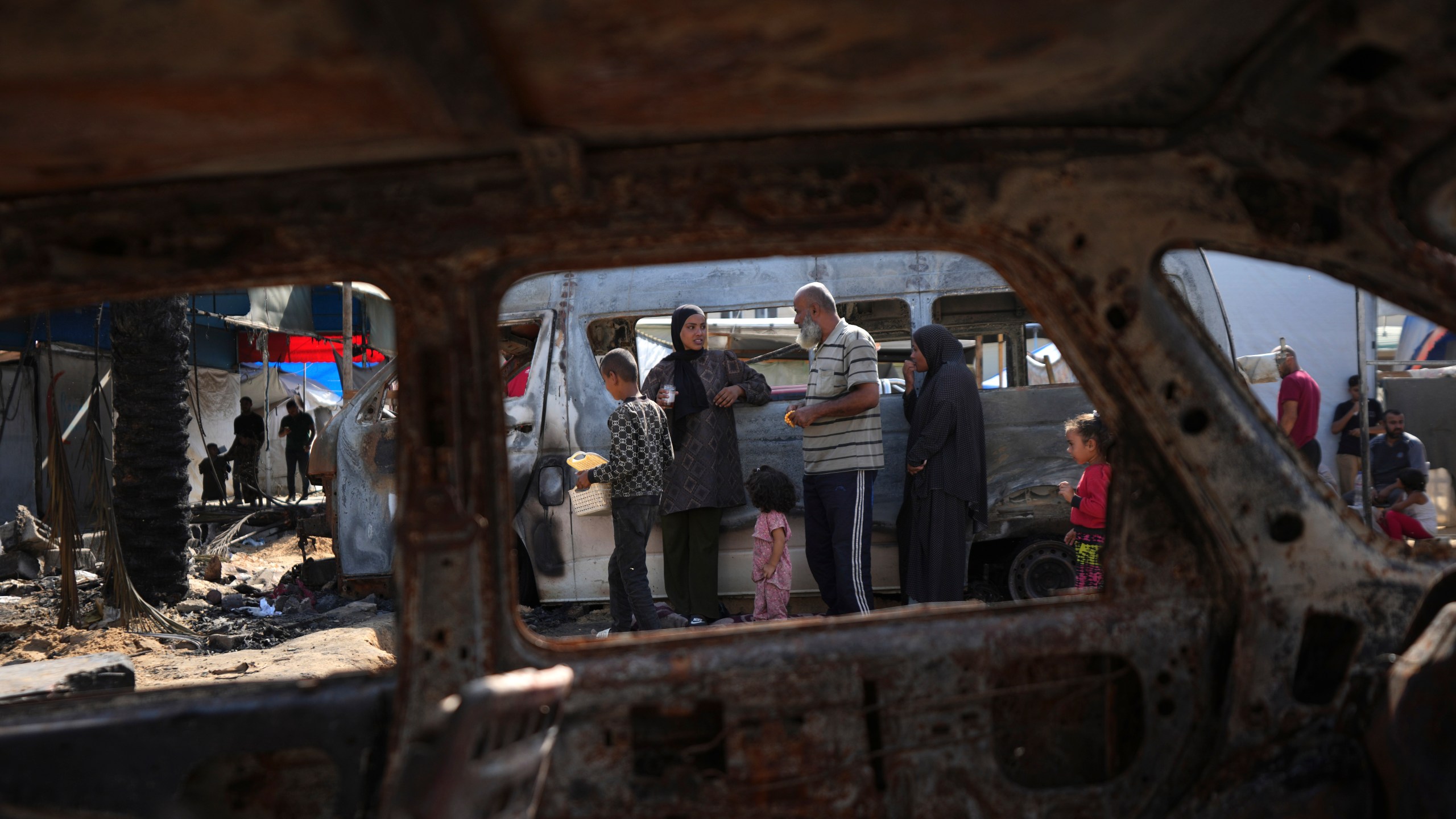 The site of a deadly fire, after an Israeli strike hit a tent area in the courtyard of Al Aqsa Martyrs hospital in Deir al-Balah, Gaza Strip, Wednesday, Oct. 16, 2024. (AP Photo/Abdel Kareem Hana)