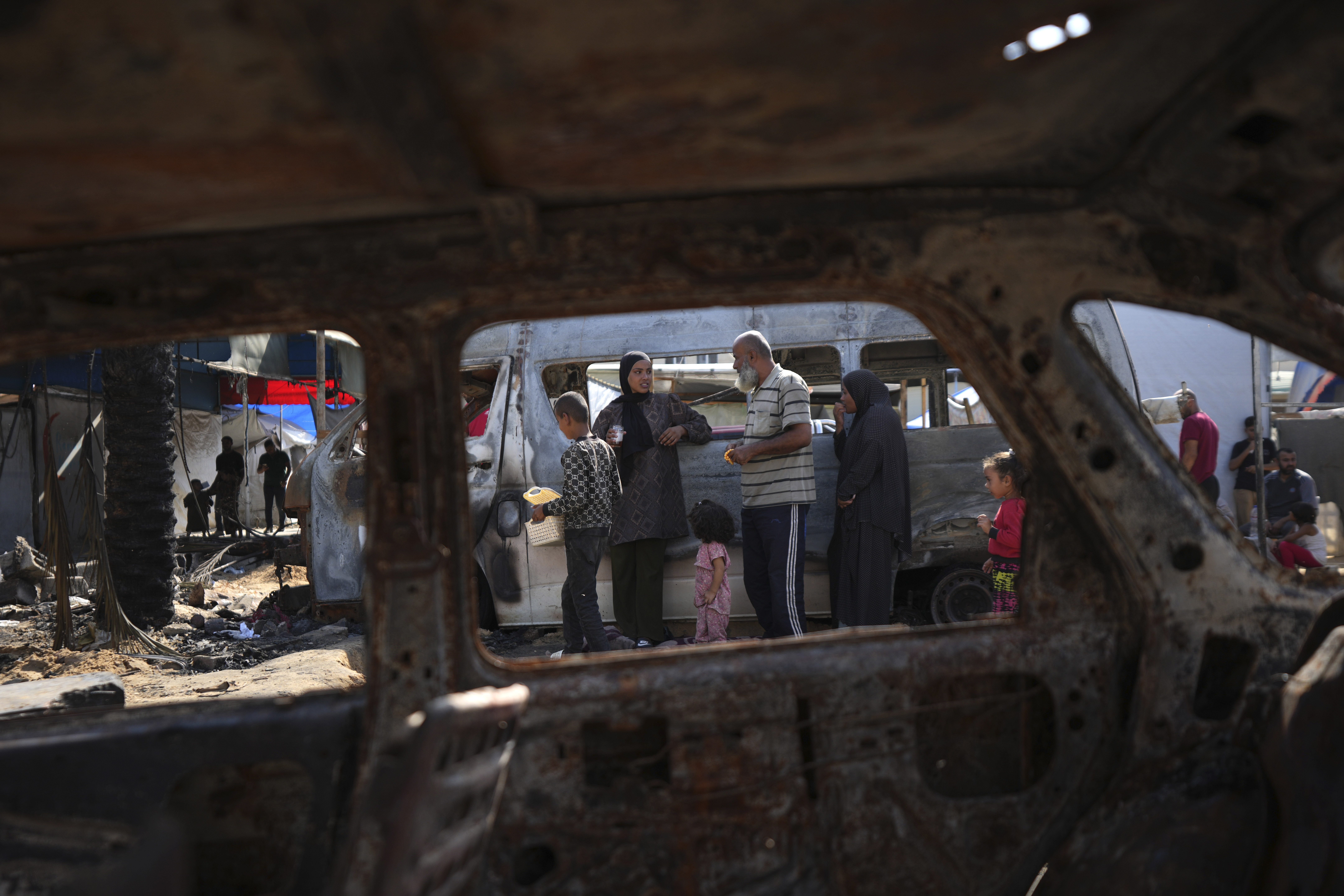 The site of a deadly fire, after an Israeli strike hit a tent area in the courtyard of Al Aqsa Martyrs hospital in Deir al-Balah, Gaza Strip, Wednesday, Oct. 16, 2024. (AP Photo/Abdel Kareem Hana)