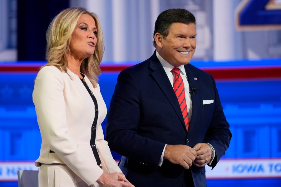 FILE - Moderators Martha MacCallum and Bret Baier appear before Republican presidential candidate former President Donald Trump speaks during a Fox News Channel town hall in Des Moines, Iowa, Jan. 10, 2024. (AP Photo/Carolyn Kaster, File)