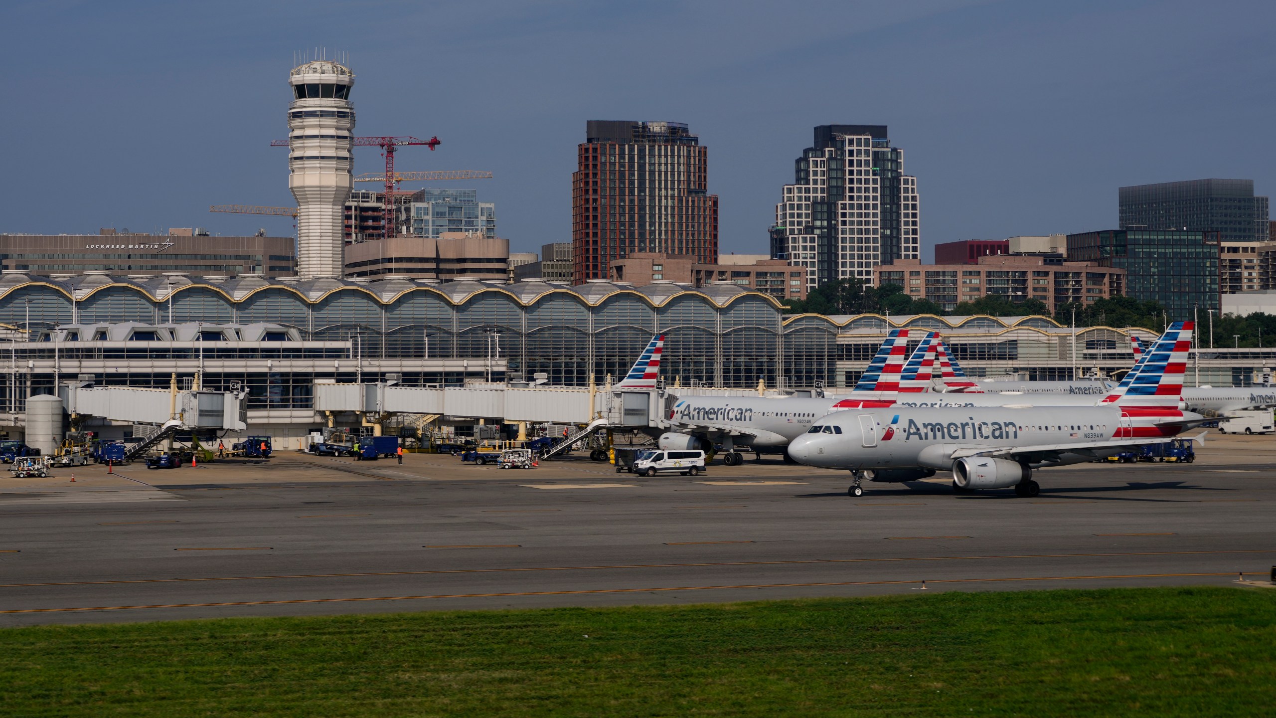 FILE - Planes are parked at gates are at Ronald Reagan Washington National Airport in Arlington, Va., Sunday, Aug. 27, 2023, in Washington. (AP Photo/Carolyn Kaster, File)