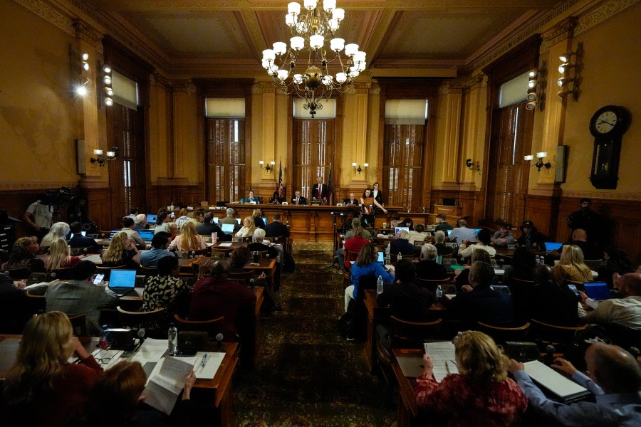 Georgia's State Election Board members discuss proposals to a full room for election rule changes at the state capitol, Friday, Sept. 20, 2024, in Atlanta. (AP Photo/Mike Stewart)