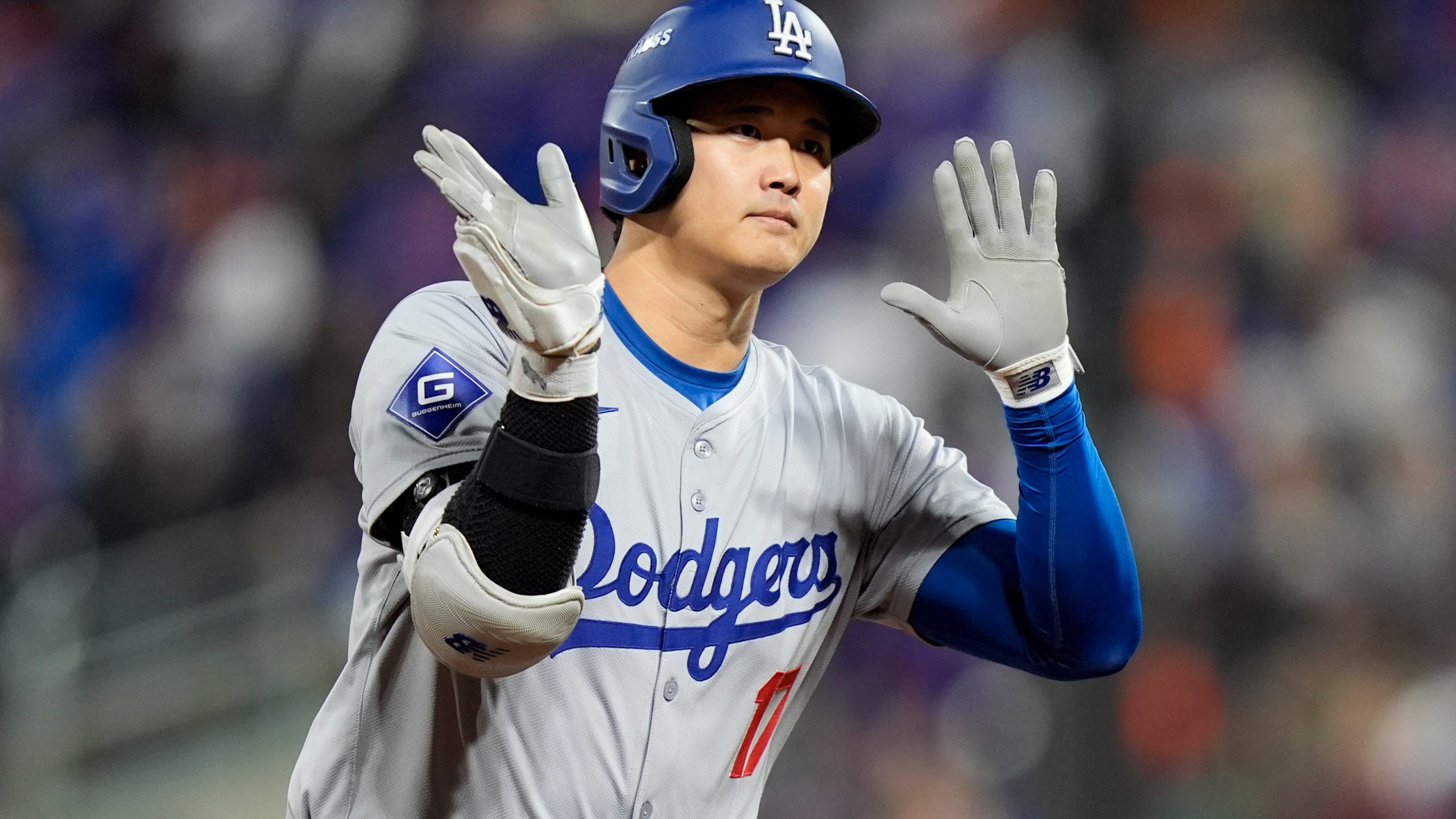 Los Angeles Dodgers' Shohei Ohtani celebrates his three-run home run against the New York Mets during the eighth inning in Game 3 of a baseball NL Championship Series, Wednesday, Oct. 16, 2024, in New York. (AP Photo/Frank Franklin II)