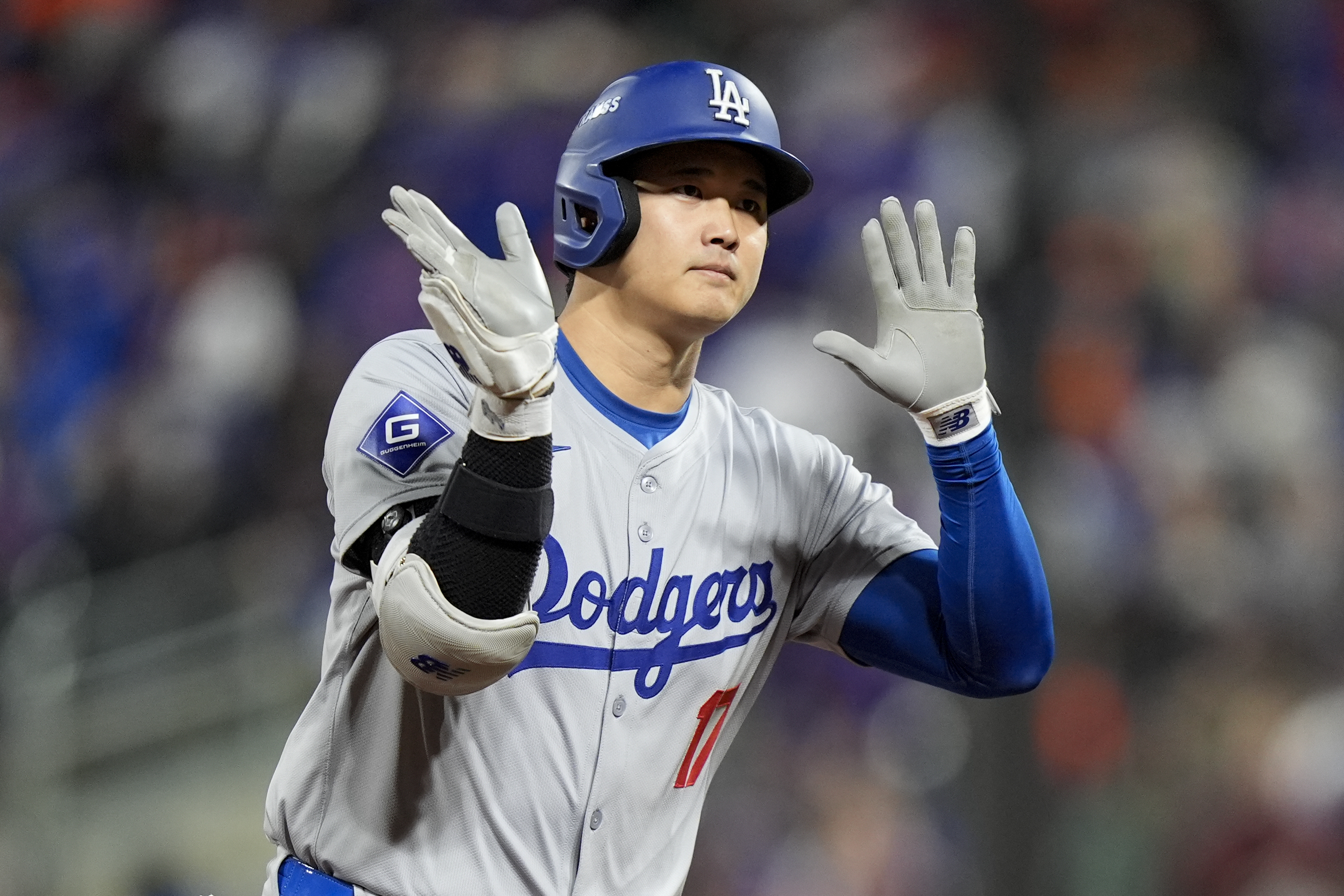 Los Angeles Dodgers' Shohei Ohtani celebrates his three-run home run against the New York Mets during the eighth inning in Game 3 of a baseball NL Championship Series, Wednesday, Oct. 16, 2024, in New York. (AP Photo/Frank Franklin II)